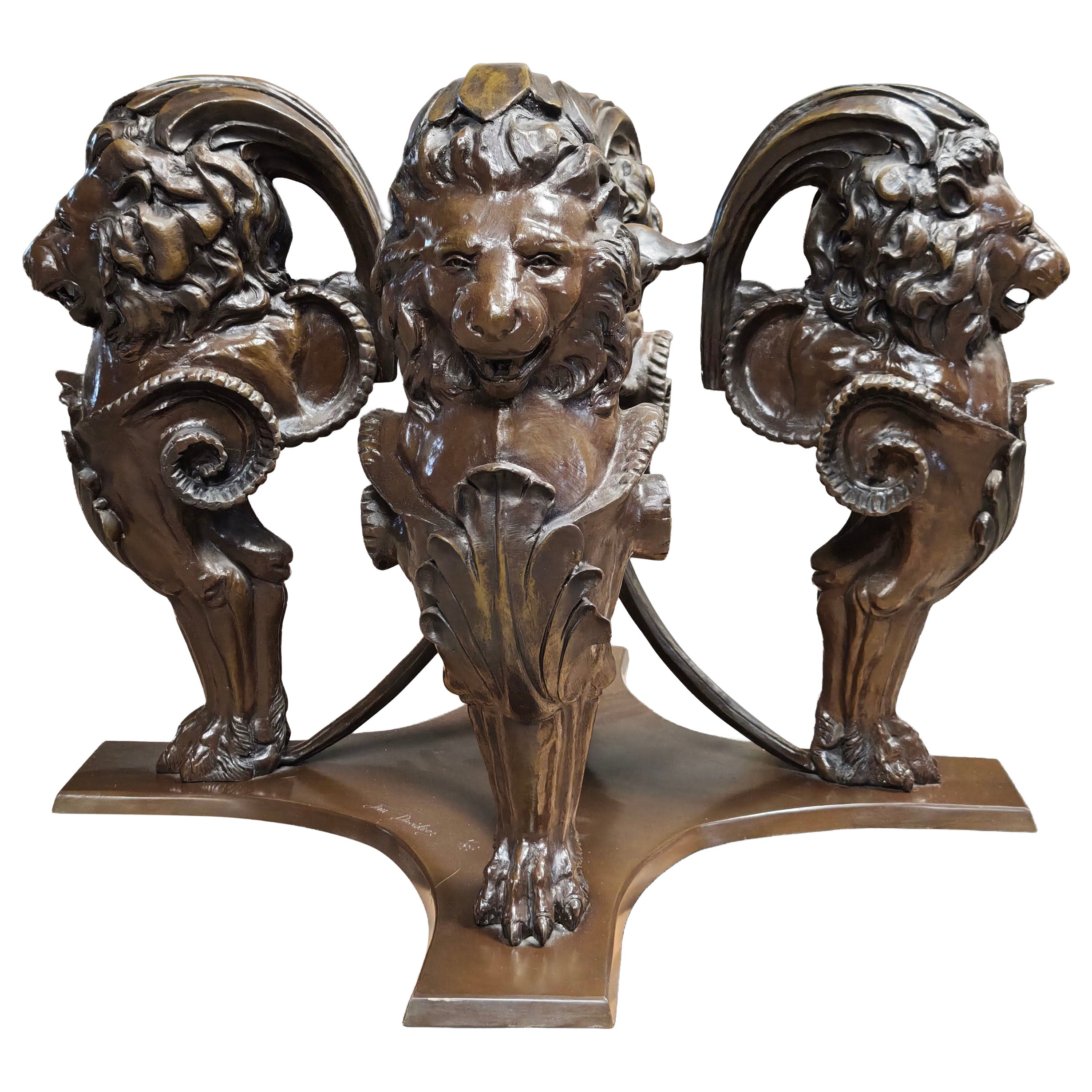 Table base in bronze with four lions. Based on models derived from Rome For Sale