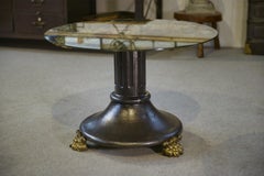 Table basse en fonte et verre églomisé néo-classique 1940's