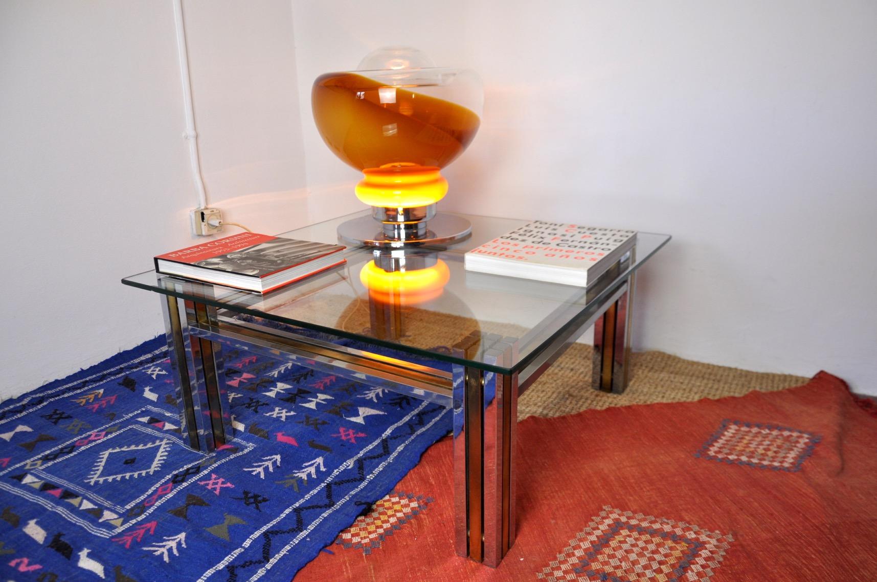 Superb coffee table in the style of romeo rega, designed and produced in italy in the 70s. Unique object that will decorate and bring a real design touch to your interior. Time mark relating to the age of the object, small damage to the glass, see