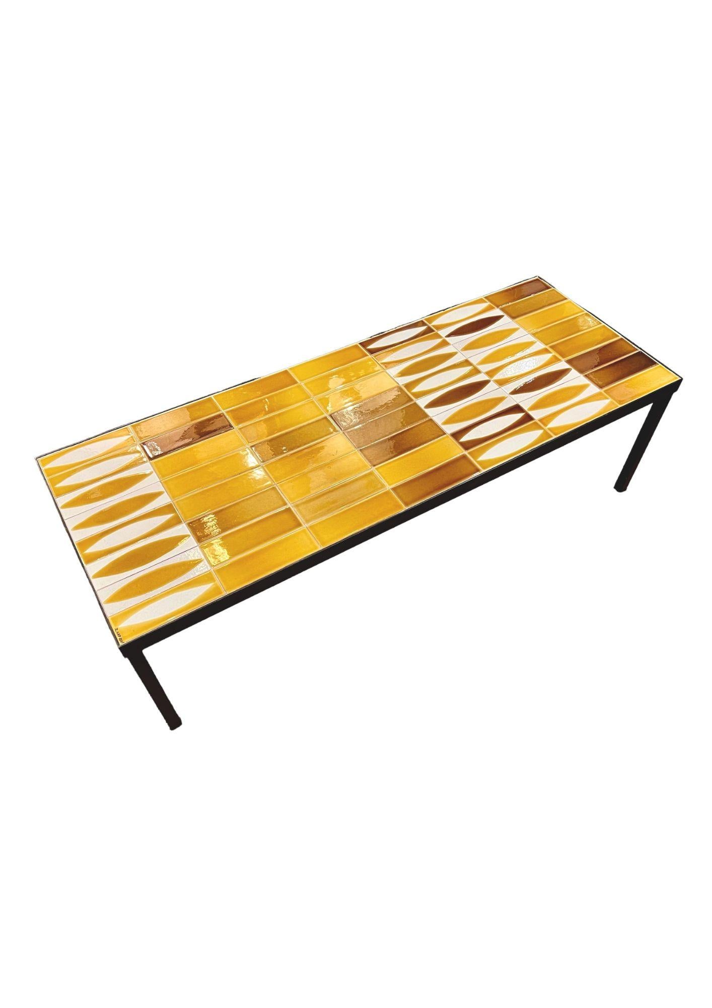 Coffee table by Roger Capron in ceramic with yellow and white shuttle design.