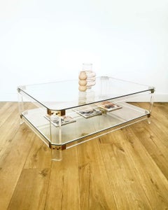 Table basse rectangulaire en verre et piètement plexiglas
