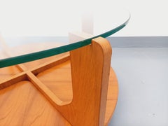 Table basse ronde à 2 plateaux vintage de Hugues Poignant, en teck et verre