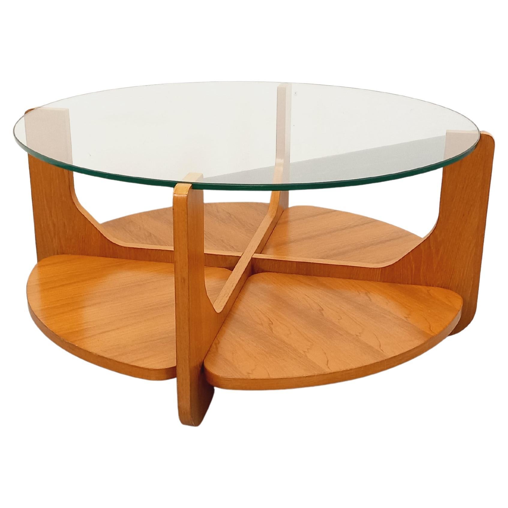 Table basse ronde à 2 plateaux vintage de Hugues Poignant, en teck et verre in vendita