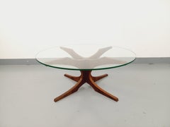 Table basse ronde vintage Hugues Poignant, en palissandre et verre des années 60