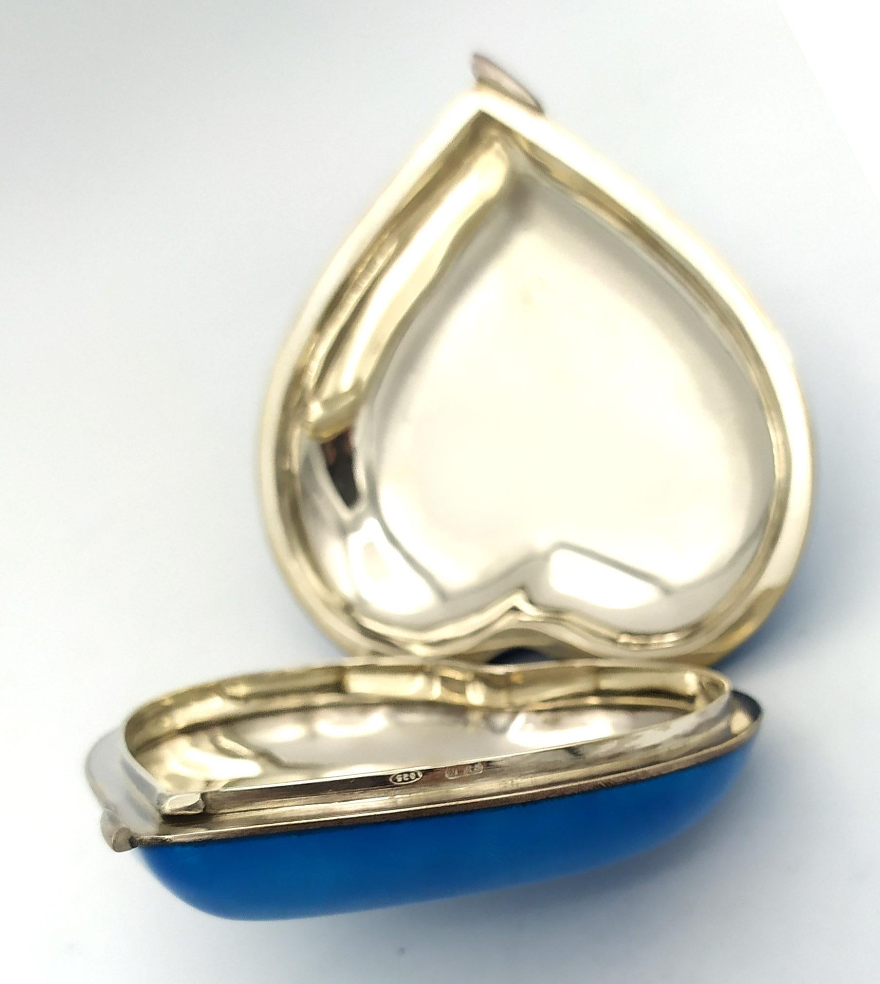 Heart-shaped table box in 925/1000 sterling silver with translucent fired enamel on guilloché above and below. Modern contemporary style. Dimensions cm. 8 x 8.8 high cm. 2.8. Weight g. 160. Designed by Giorgio Salimbeni in 1990 and produced at the