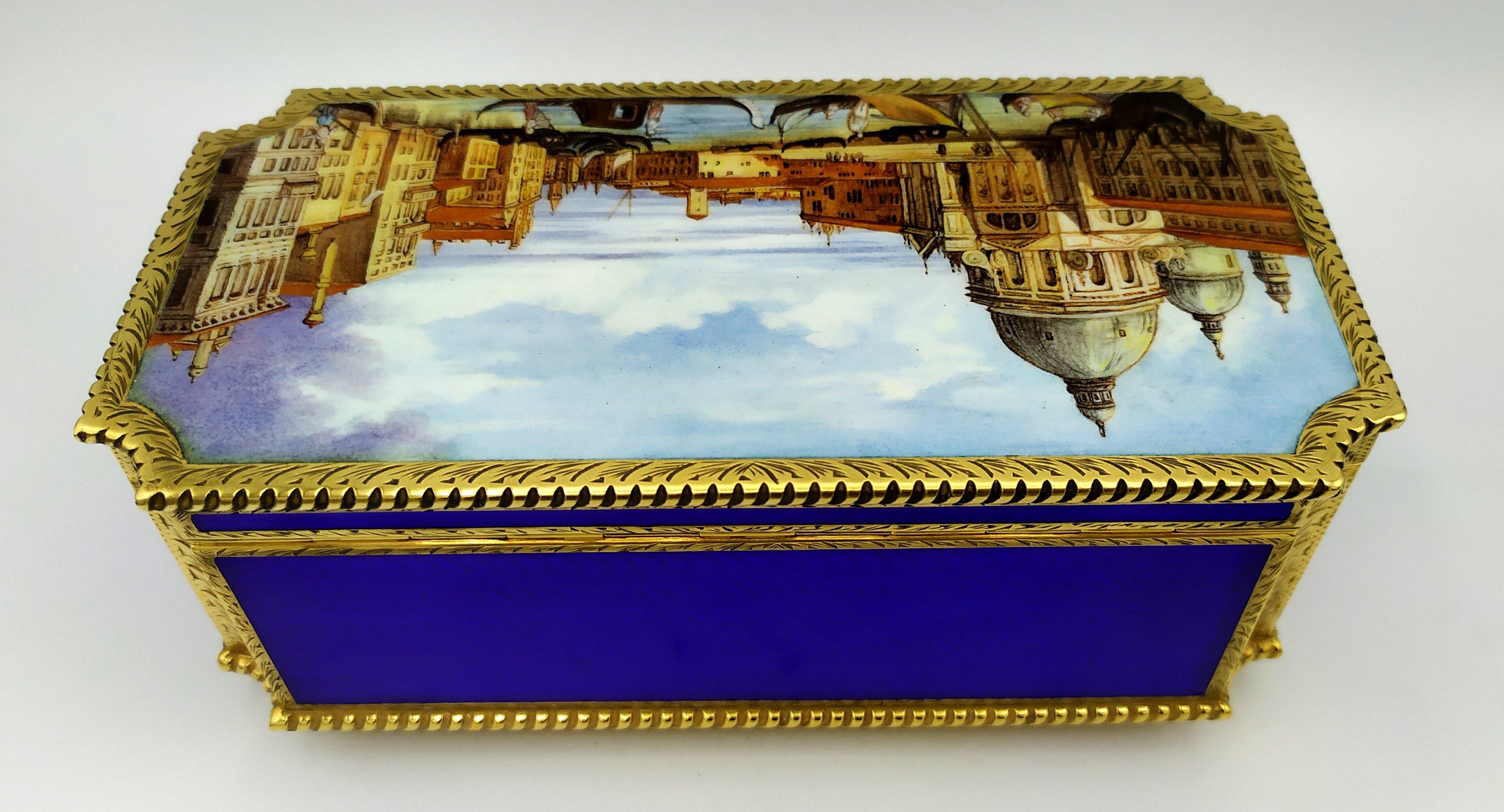 Large rectangular table box with concave corners, with mechanical musical movement with 3 different motifs by the Swiss company Reuge S.A. in 925/1000 sterling silver gold plated with translucent enamelled sides on guilloché and border in modern