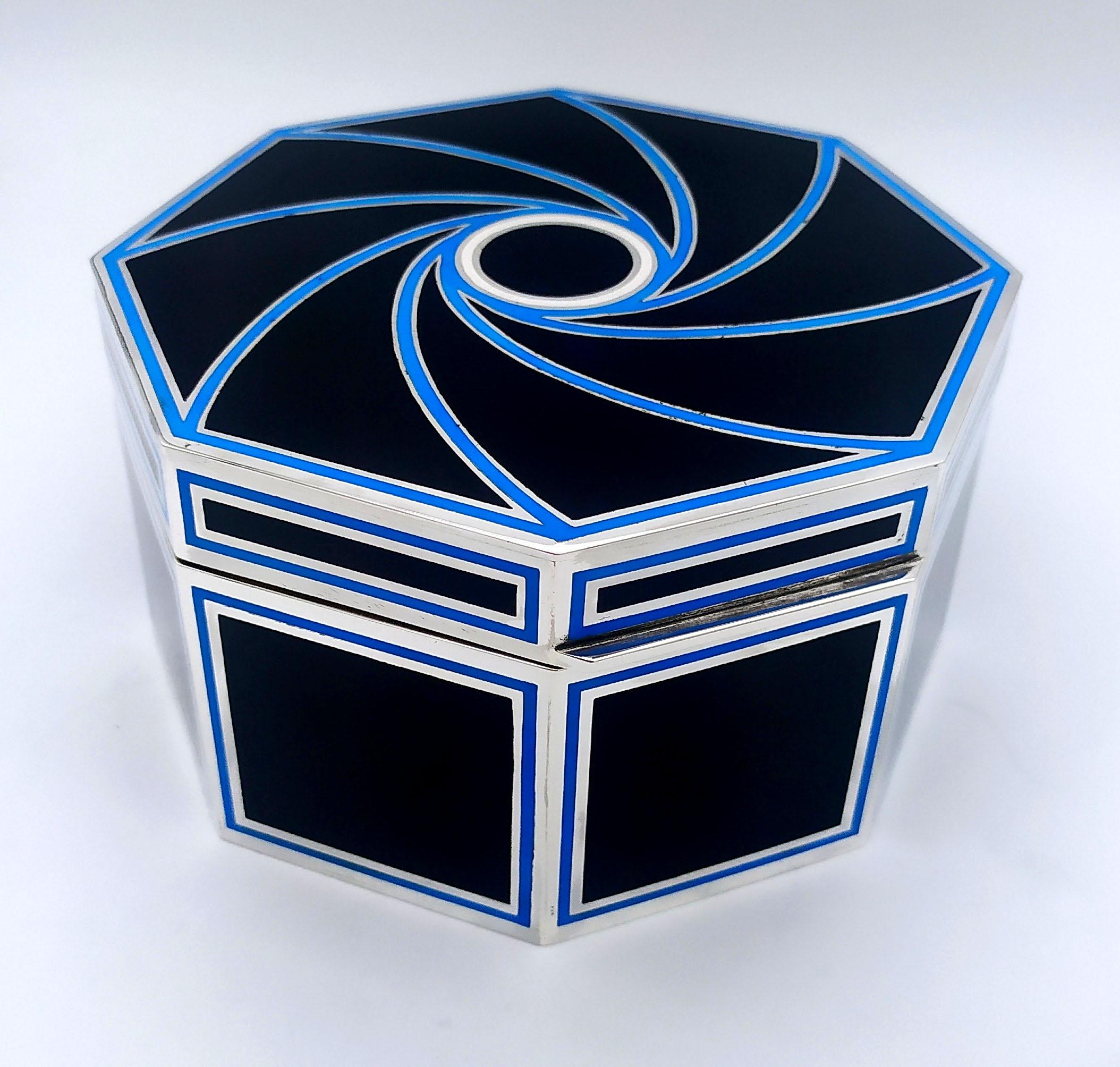 Octagonal table box in 925/1000 sterling silver with fire-enamelled Art Deco design. Dimensions diameter cm. 15.8 high cm . 8.2. Weight gr. 974. Designed by Giorgio Salimbeni for Cartier USA in the 1980s, inspired by objects designed by Louis