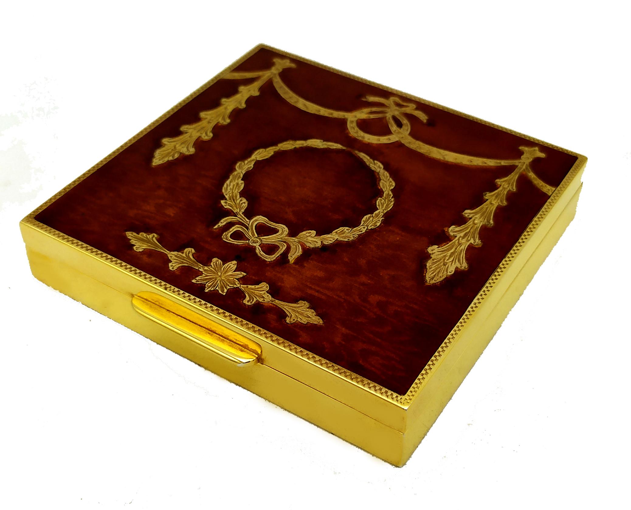 Rectangular table box in gold-plated 925/1000 sterling silver with fine hand-engraved ornaments in late Napoleon III Empire style and transparent brown fired enamel over hand-engraved wood grain. Dimensions cm. 9 x 8.7 x 1.7. Weight g. 256. Designed