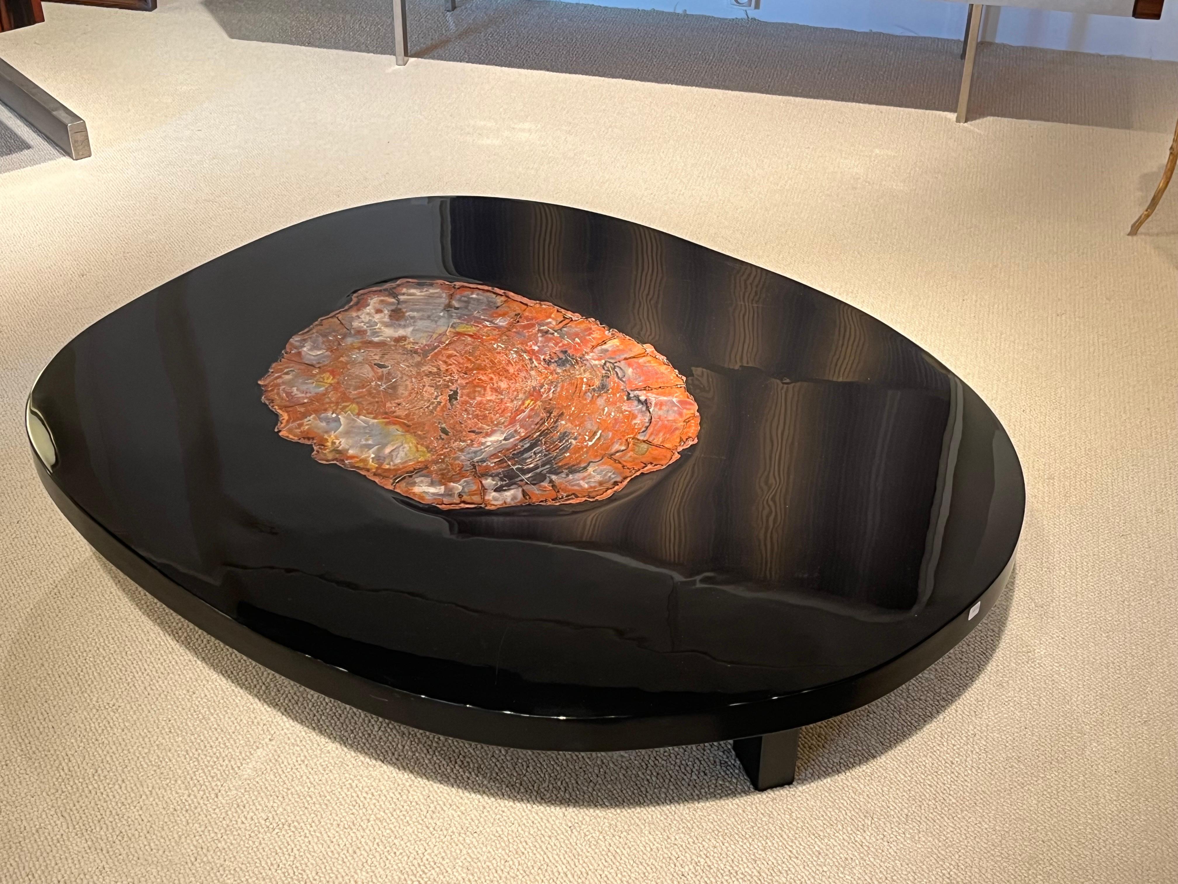 Black round table by Ado Chale, 1970s
Resin and fossilized wood 
Unique piece.