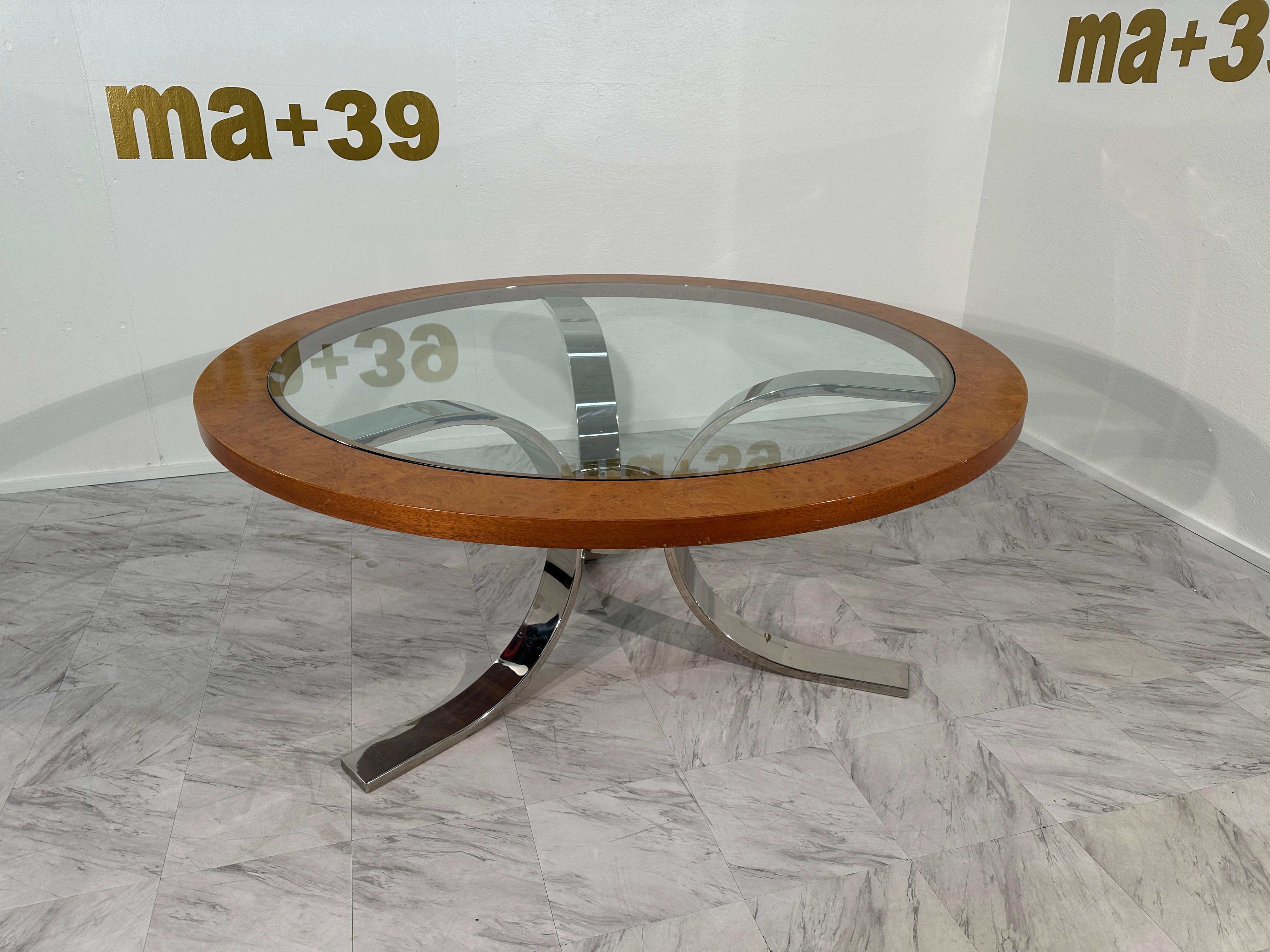 Dining table by Dada Industrial Design in nickel plated steel. 
From a famous appartment in Nice, decoreded 1973 by Gilbert Lamaletti .
70s table Dada international chromed legs and circular table with transparent glass and wooden edging which makes