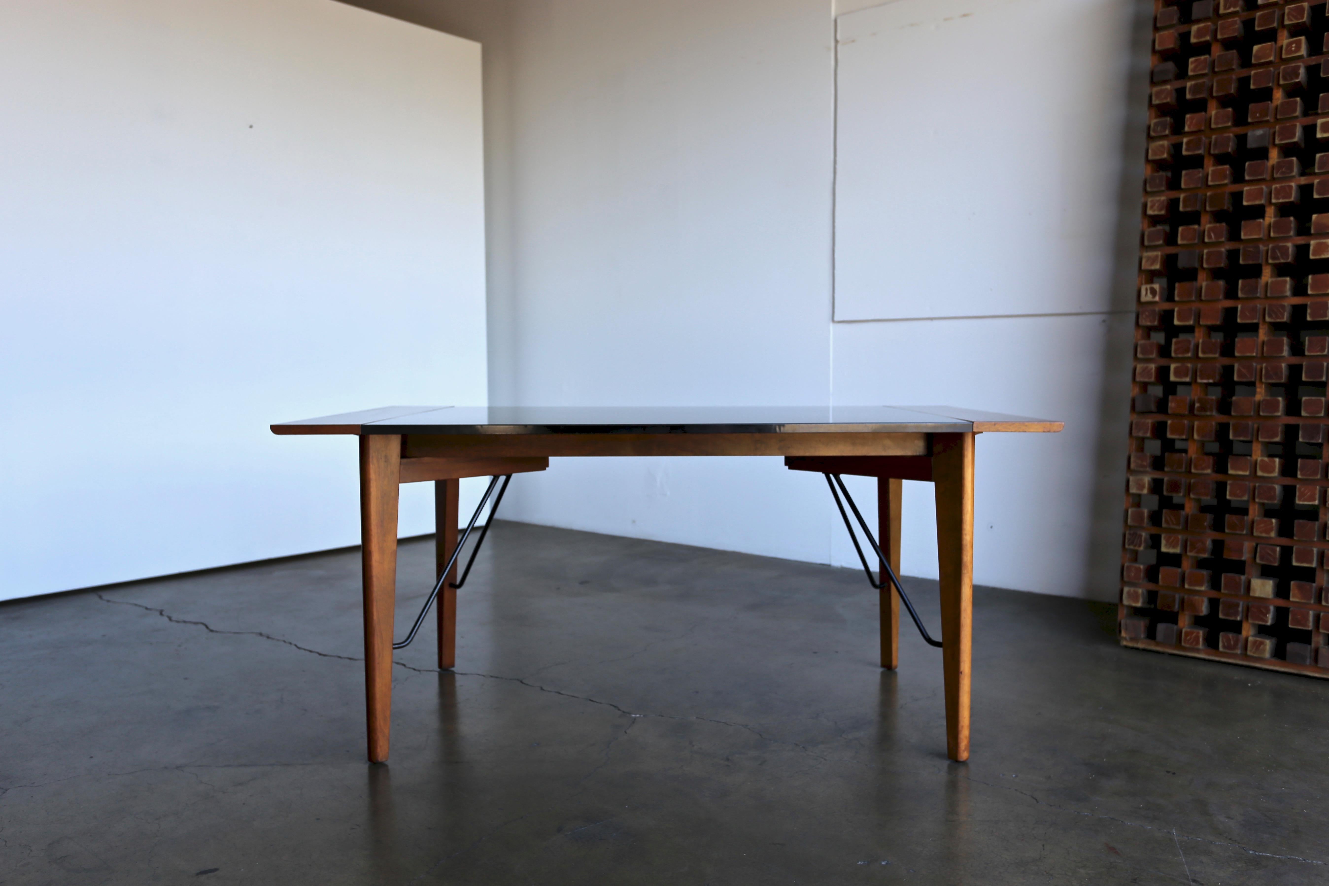 Dining or writing table by Greta Grossman for Glenn California, 1952. This table is in very good original condition. 

This table extends to 85.63