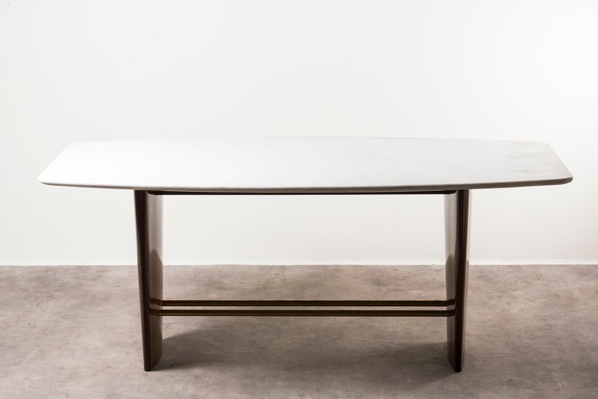 Table by Joaquim Tenreiro, Brazil, 1960. Wood, brass, marble. Measures: 90 x 187 x H 75 cm. 35.4 x 73.6 x H 29.5 in.
Please note: Prices do not include VAT. VAT may be applied depending on the ship-to location.
The product shows scratches and stains.
