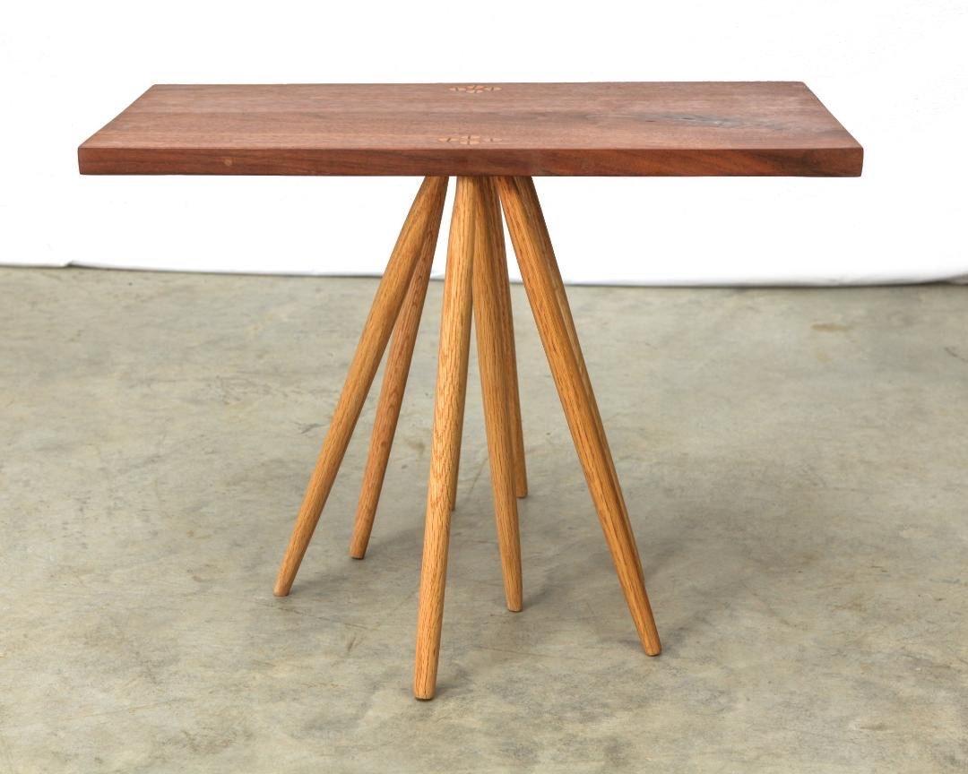 Table with rectangular top and eight legs by Michael Rozell, USA, 2021.
Oak legs and walnut top.