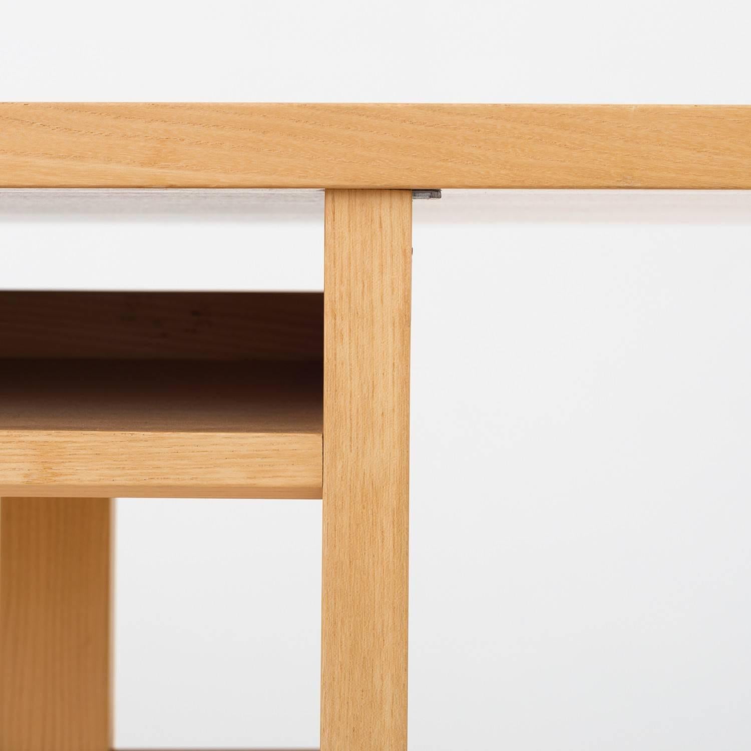 Library table in elm with shelf. Maker Rud. Rasmussen.