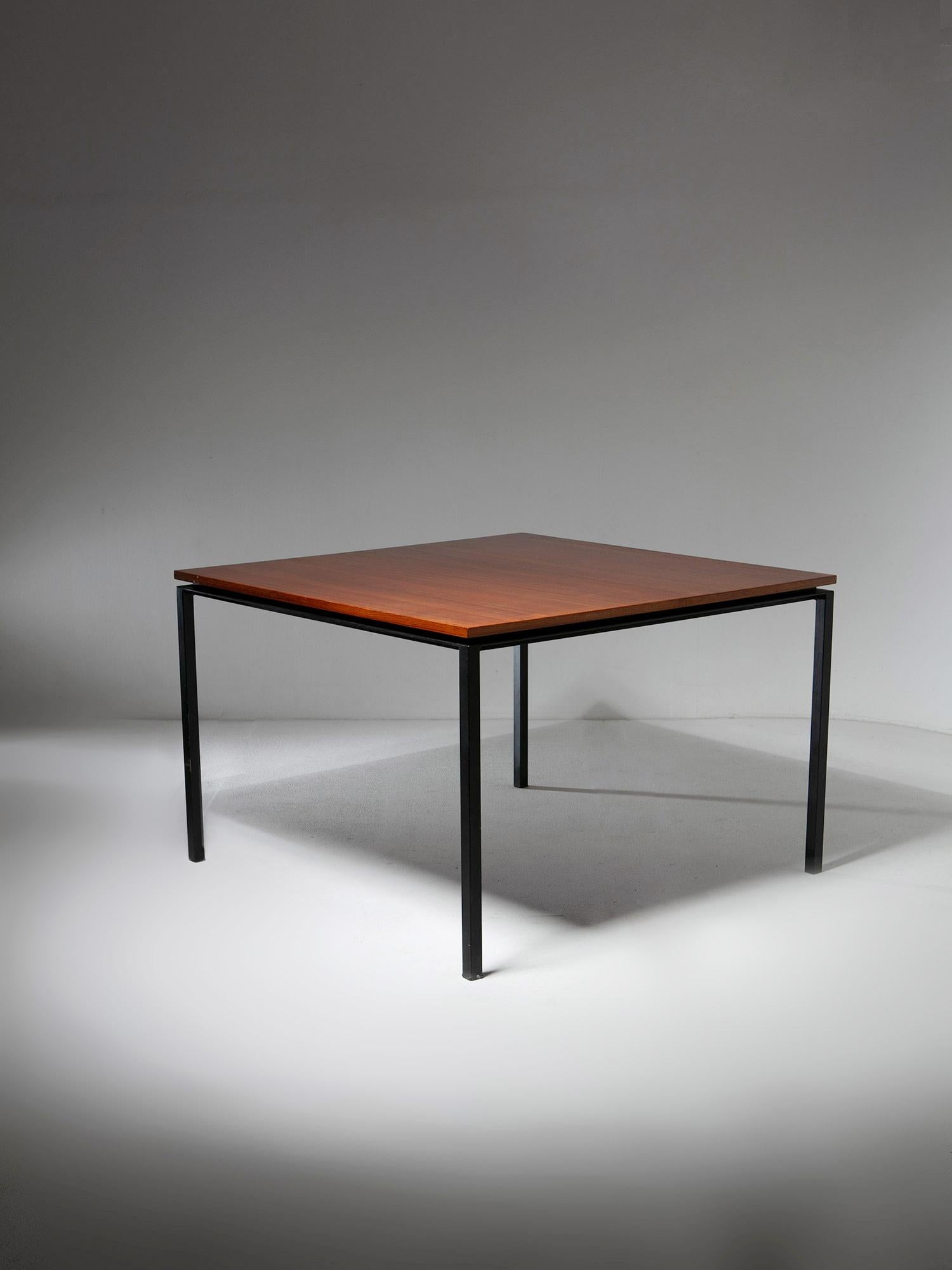 Squared dining table by Paolo Tiche for Arform.
Black metal sturdy frame supports a thin teak wood top.
