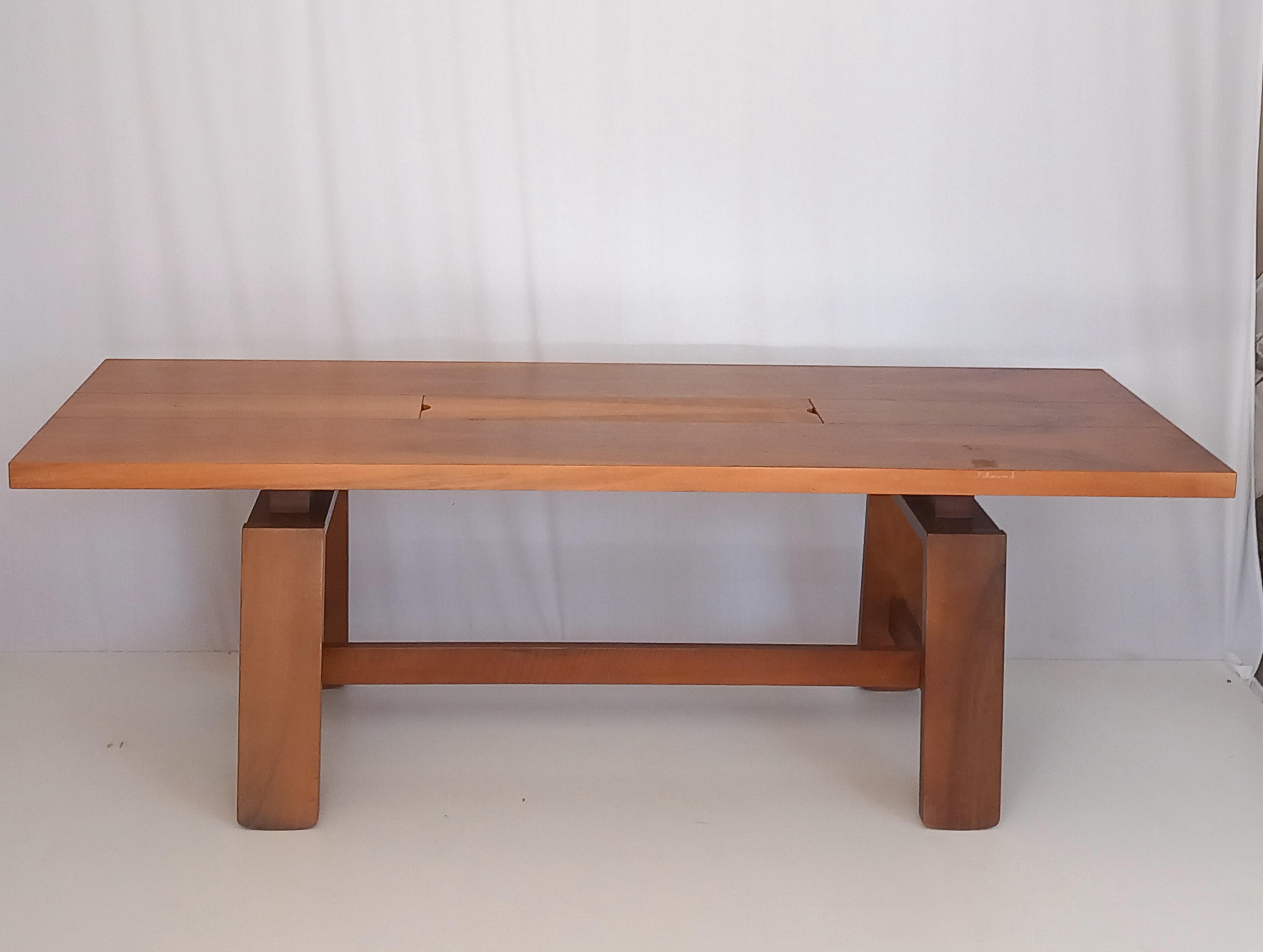 Introducing a piece of furniture which is undoubtedly a symbol of timeless Italian design: a walnut table designed by the iconic architect and designer Silvio Coppola. This masterpiece was produced by the renowned Italian furniture firm Bernini in