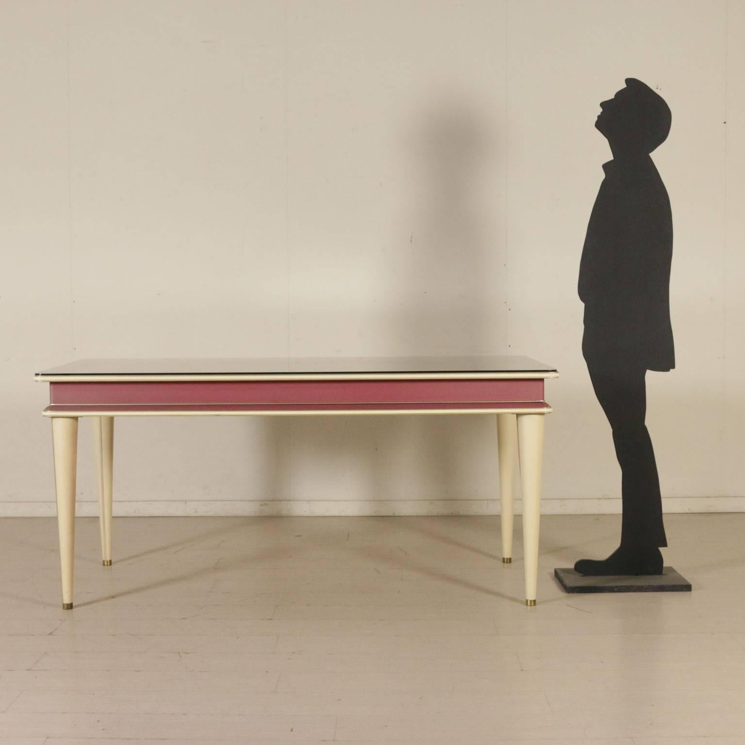 A table designed by Umberto Mascagni. Covered skai, vinyl material and brass outlines, transparent glass on the top. Manufactured in Bologna, Italy, 1950s.
