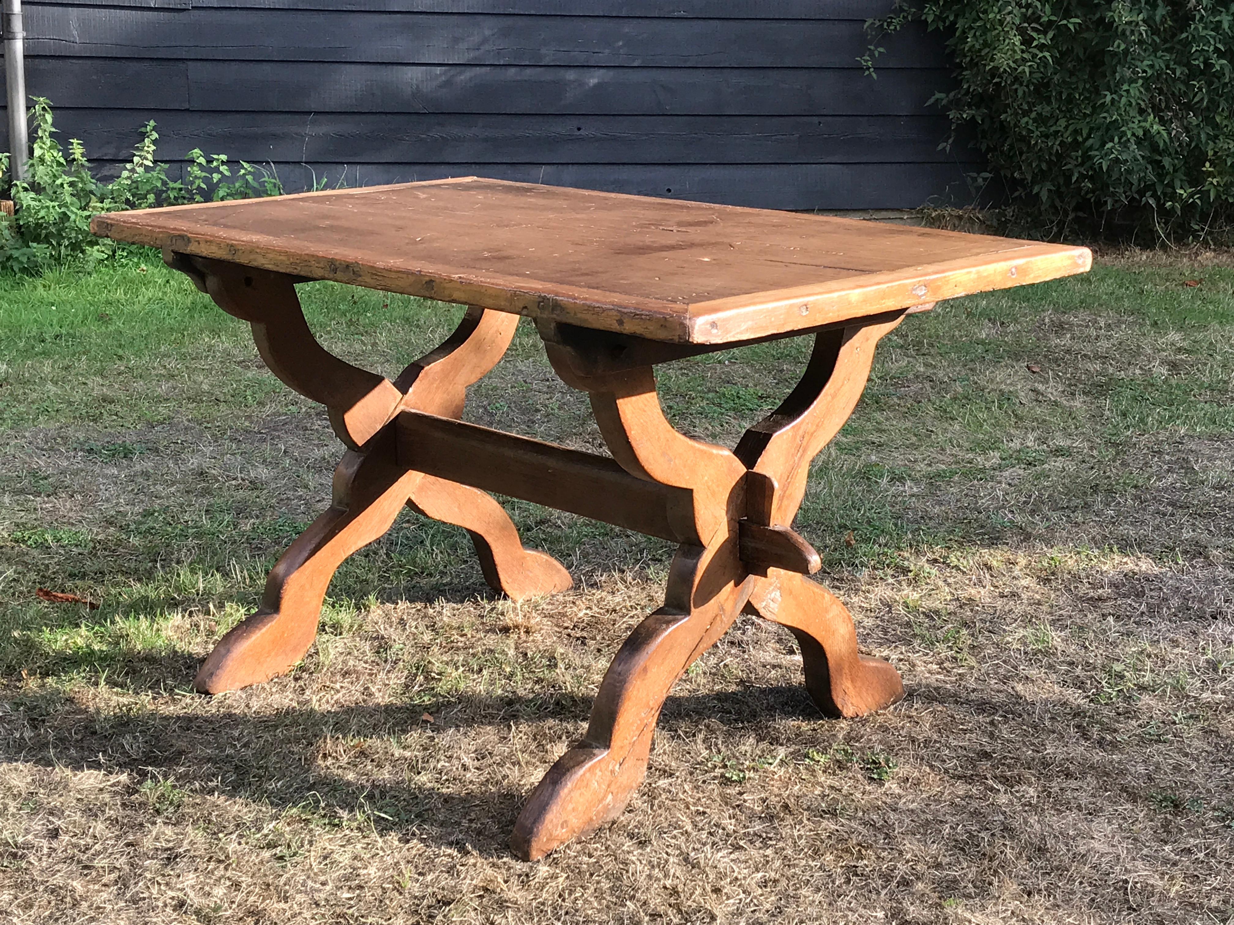 A South German oak, shaped X' ended table with detachable fruitwood top with decorative cleated band
This table is easily dismantled and retains the original pegs
The cleated edge creates a decorative banding
Provenance: Giffords Hall