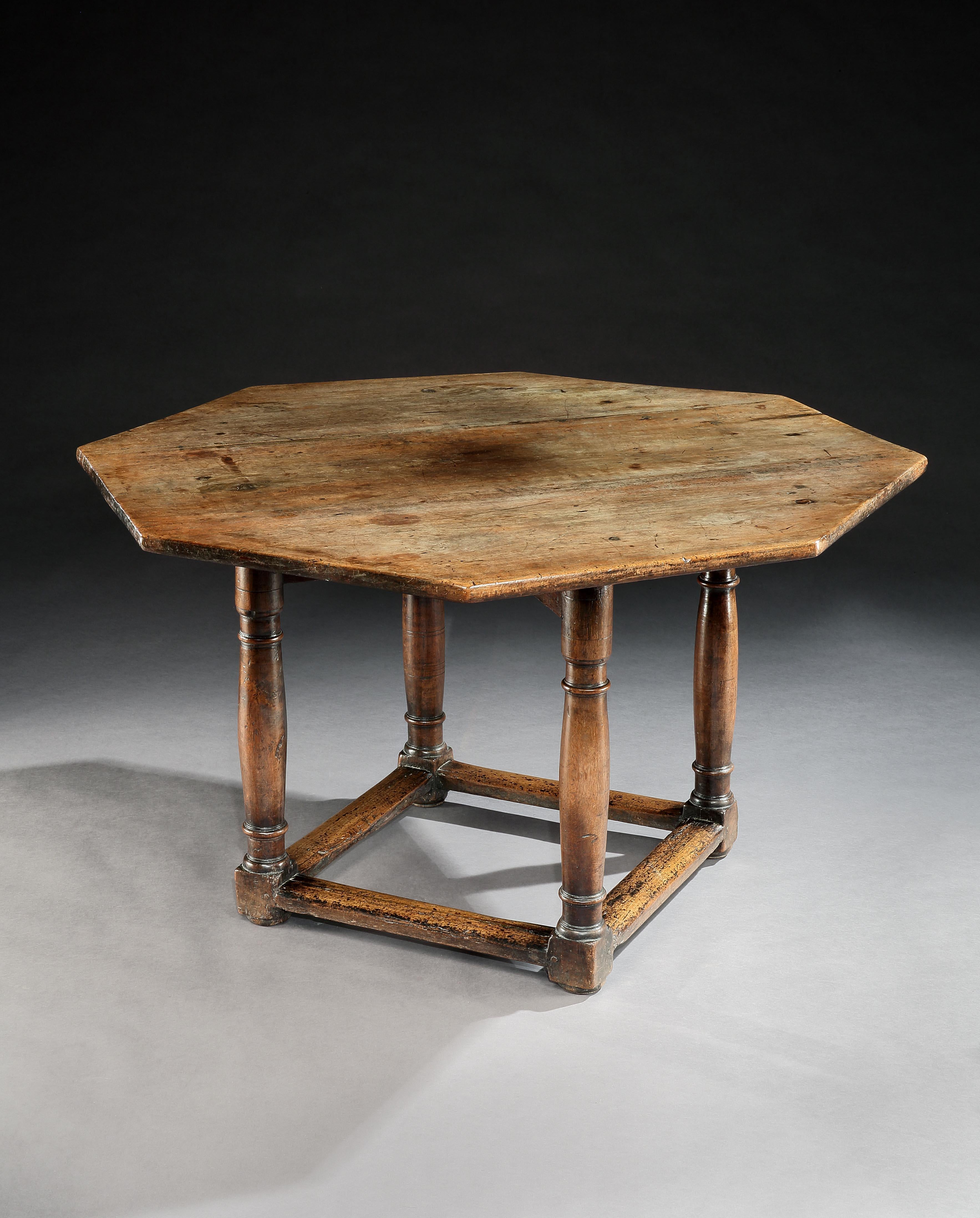 This table is of a rare and attractive form with characteristic Renaissance legs. It can serve as centre, dining or writing table. It has a lovely mellow color and lustrous patina. The top and base are original early 17th century associated elements