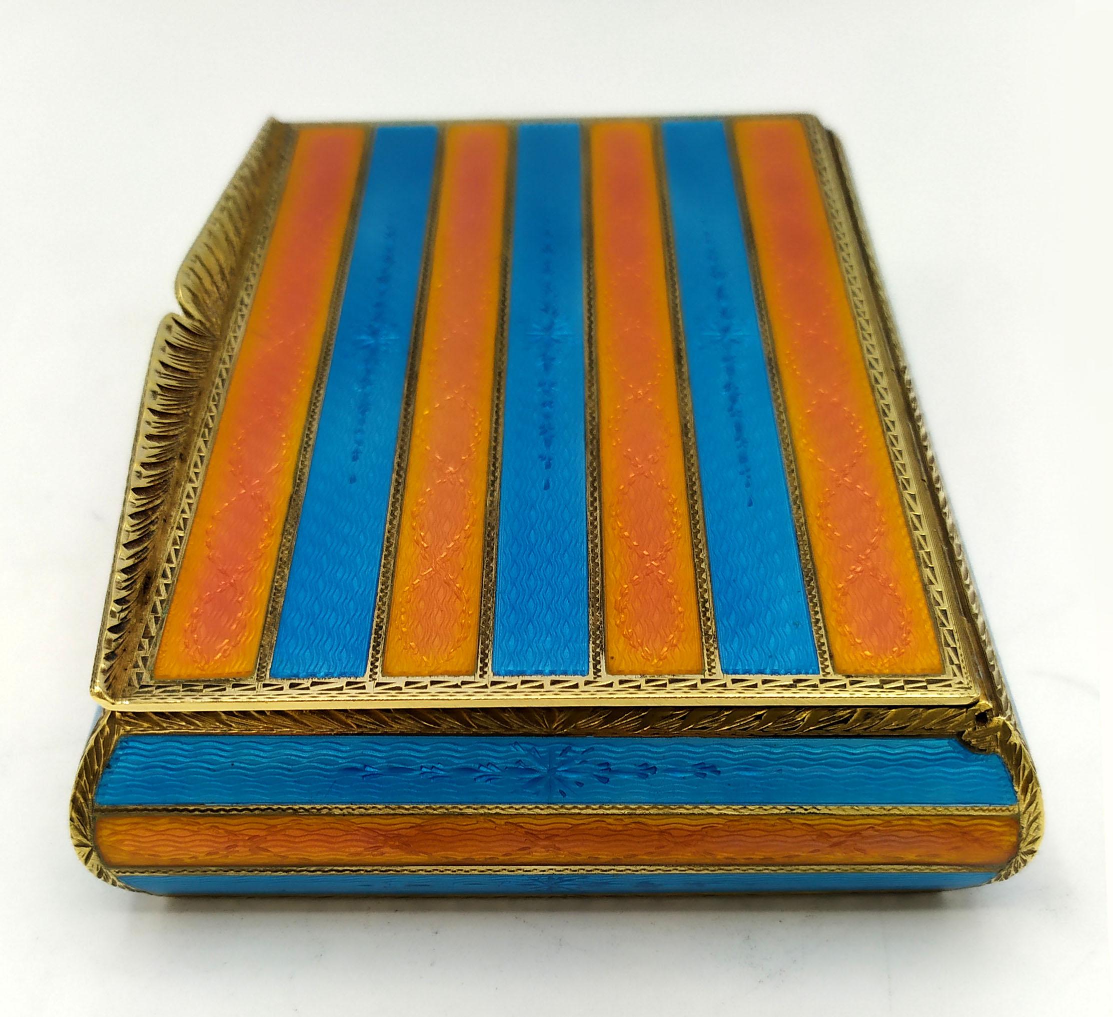 This superb Table Cigar Box two-tone stripes enamel is in 925/1000 sterling silver.
it has a rectangular shape with rounded sides Table Cigar Box has hand engraving, with orange and sky color stripes fire enameled surface on guilloche all around (
