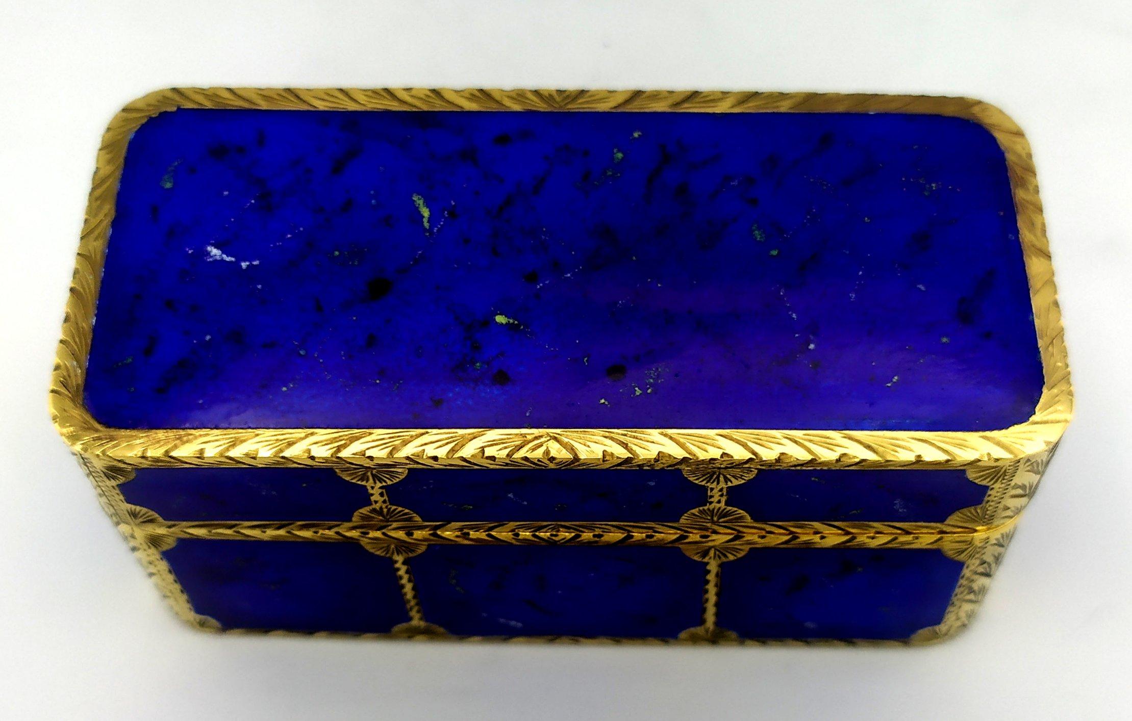 Rectangular with rounded corners table box for cigarettes in 925/1000 sterling silver gold plated with translucent enamels on a radial guilloché and hand-engraved finishes, in a modern contemporary style. Dimensions cm. 10 x 13 x 3. Weight g. 449.