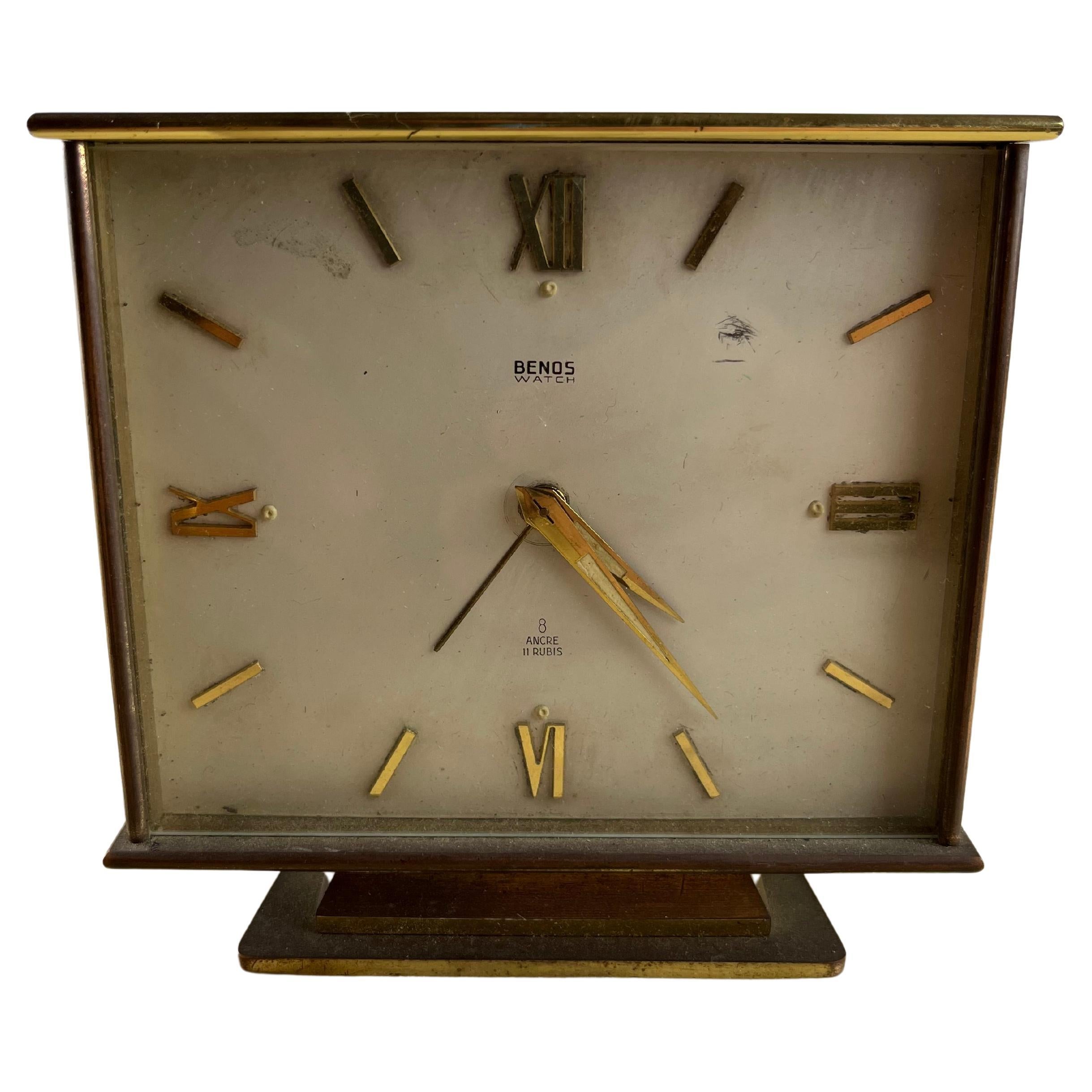 Table clock / alarm clock in brass, working, Switzerland, 60s
Signs of time and use, works perfectly.
It has always belonged to my family, it was given to my grandfather for his graduation. Benos was the trademark of the Italian importer BENaglio