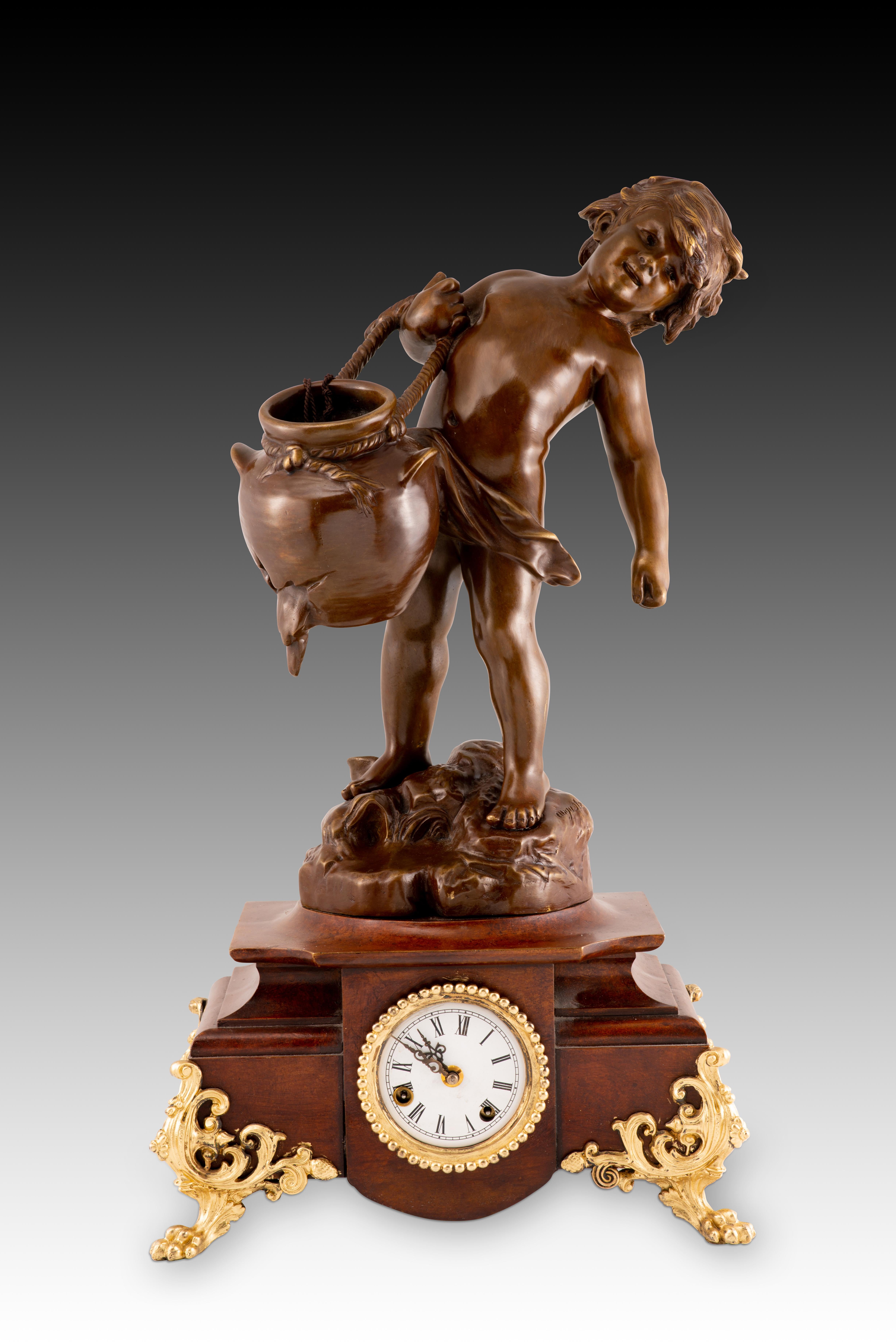  Table clock. Bronze. 1990s, modeled after August Moreau.
 In working order. at origin 
Table clock with a raised base and gilt-bronze legs following 19th-century models and a white dial with Roman numerals for the hours. It is topped with a bronze