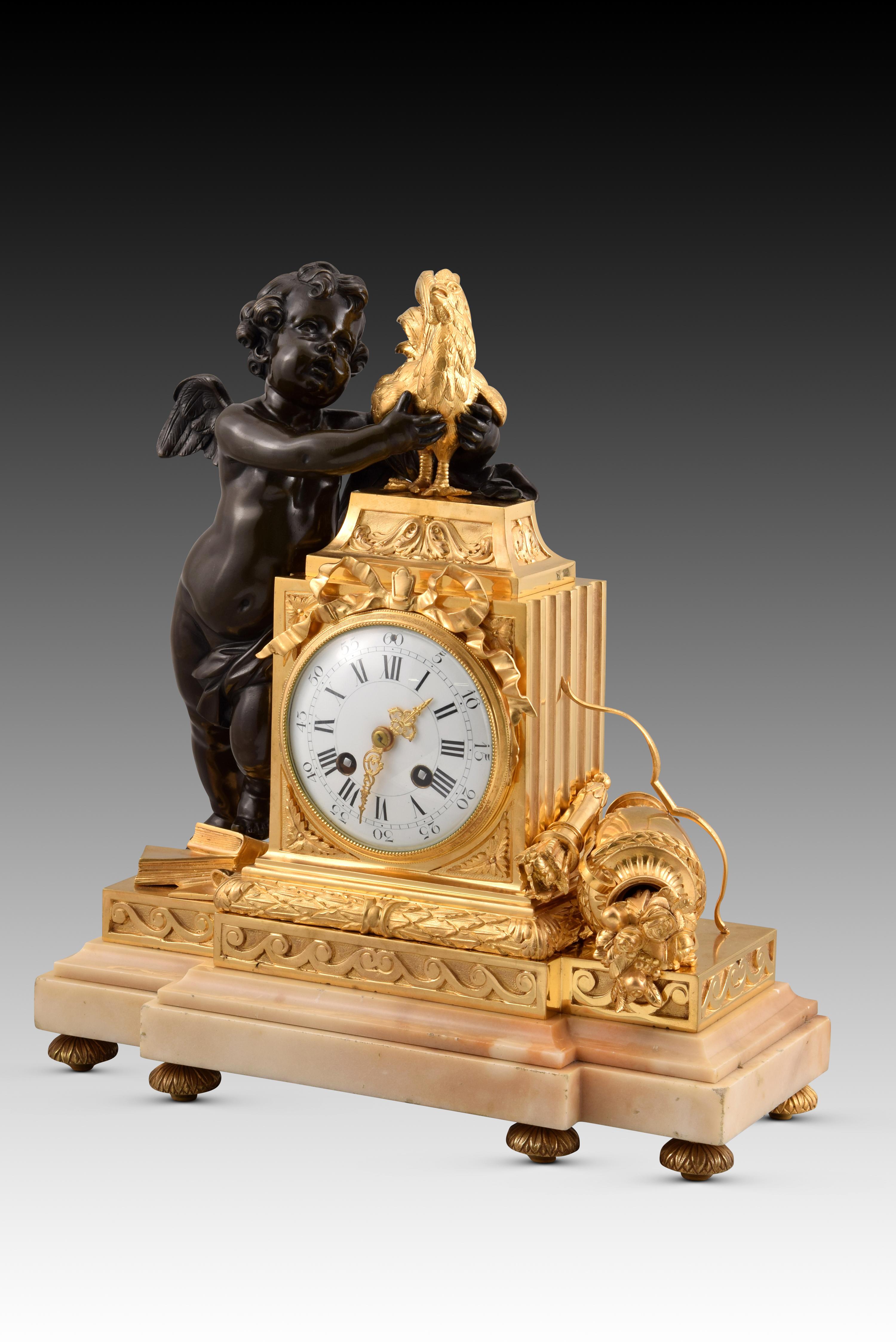 Table clock. Gilt and blued bronze, marble base. Possibly France, late 19th century. 
Working. 
Table clock with Paris machinery in working order that has a rectangular light marble base with the front slightly forward to allow space for the clock