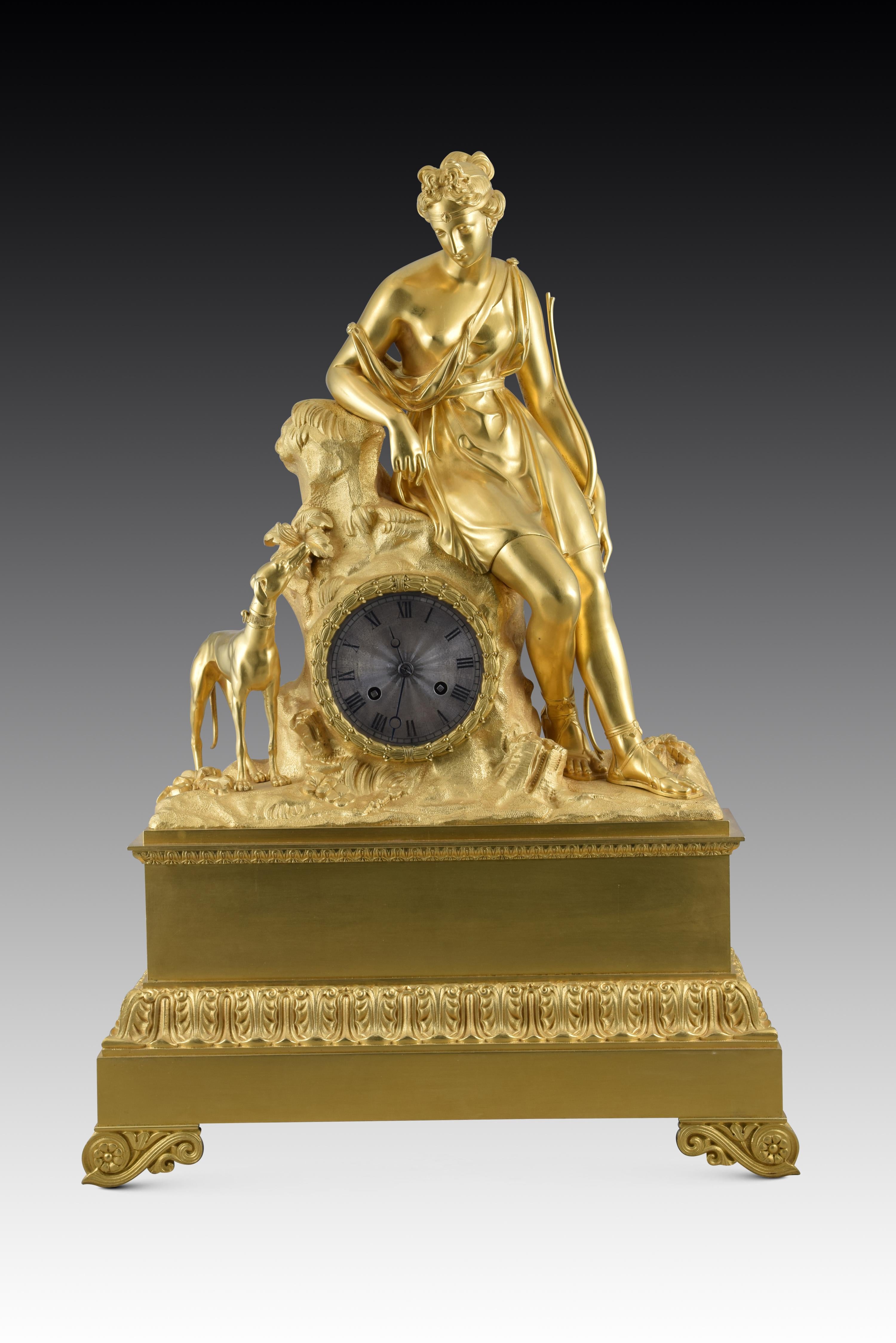 Table clock with Paris machinery, Diana the Huntress. Gilded bronze, metal. France, 19th century. 
Table clock with Paris machinery and gilt bronze case (probably mercury), composed of a rectangular base elevated on legs decorated on the front with
