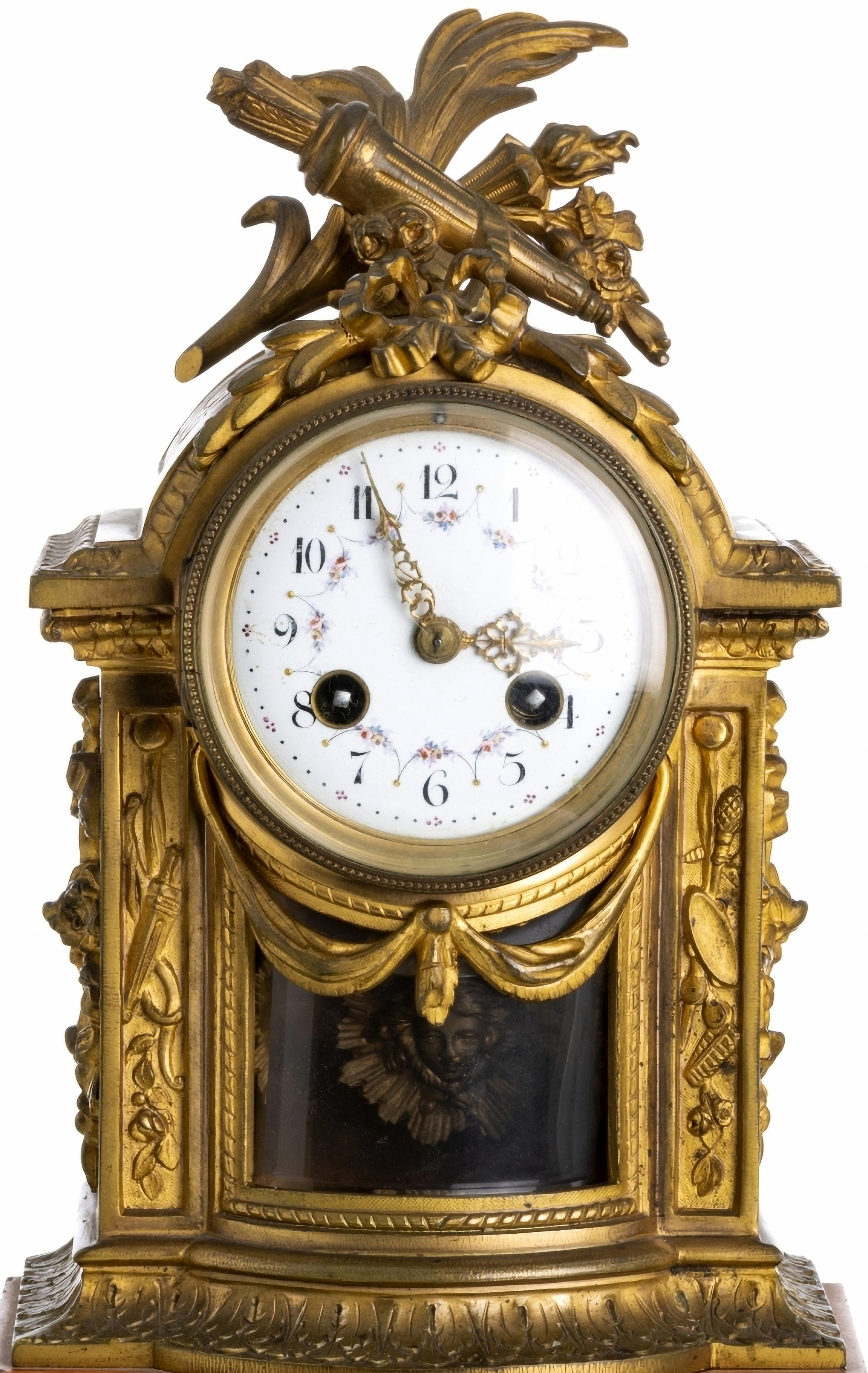 Table clock

French of the late 19th century, in gilded and relief bronze. Dial in painted enamel 
