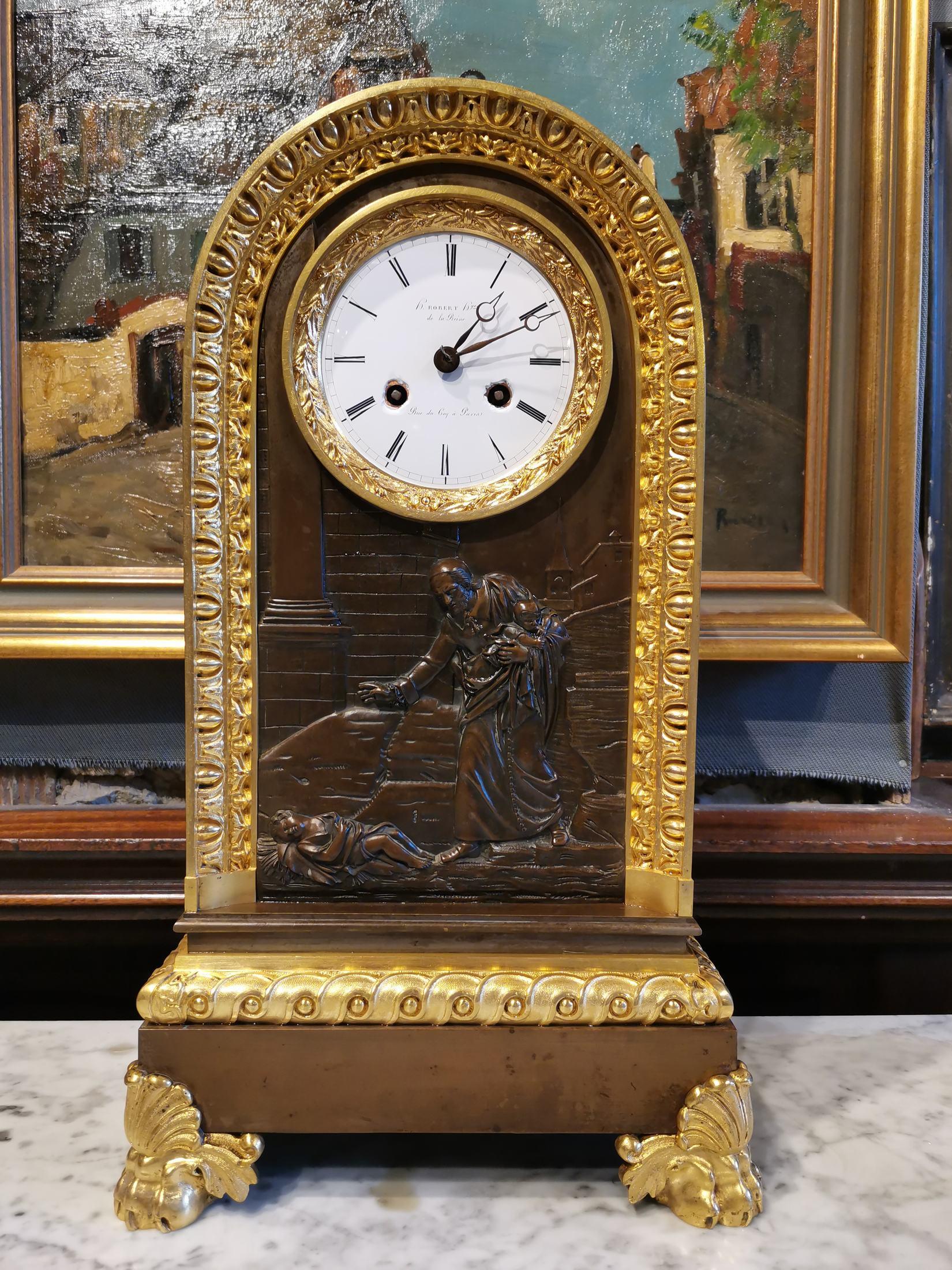 Table clock in patinated and gilded bronze from the 18th century with religious scene
Size 44 x 25 x 14 cm 1450 euro 
very good condition.