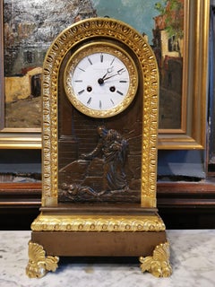 Table Clock in Patinated and Gilded Bronze from the 18th Century
