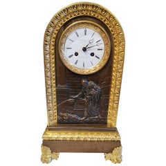 Antique Table Clock in Patinated and Gilded Bronze from the 18th Century