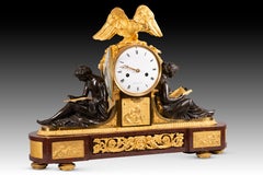 Table clock, “L'Etude” and “La Philosophie”. Gilt bronze, Rouge Griotte, etc. Me