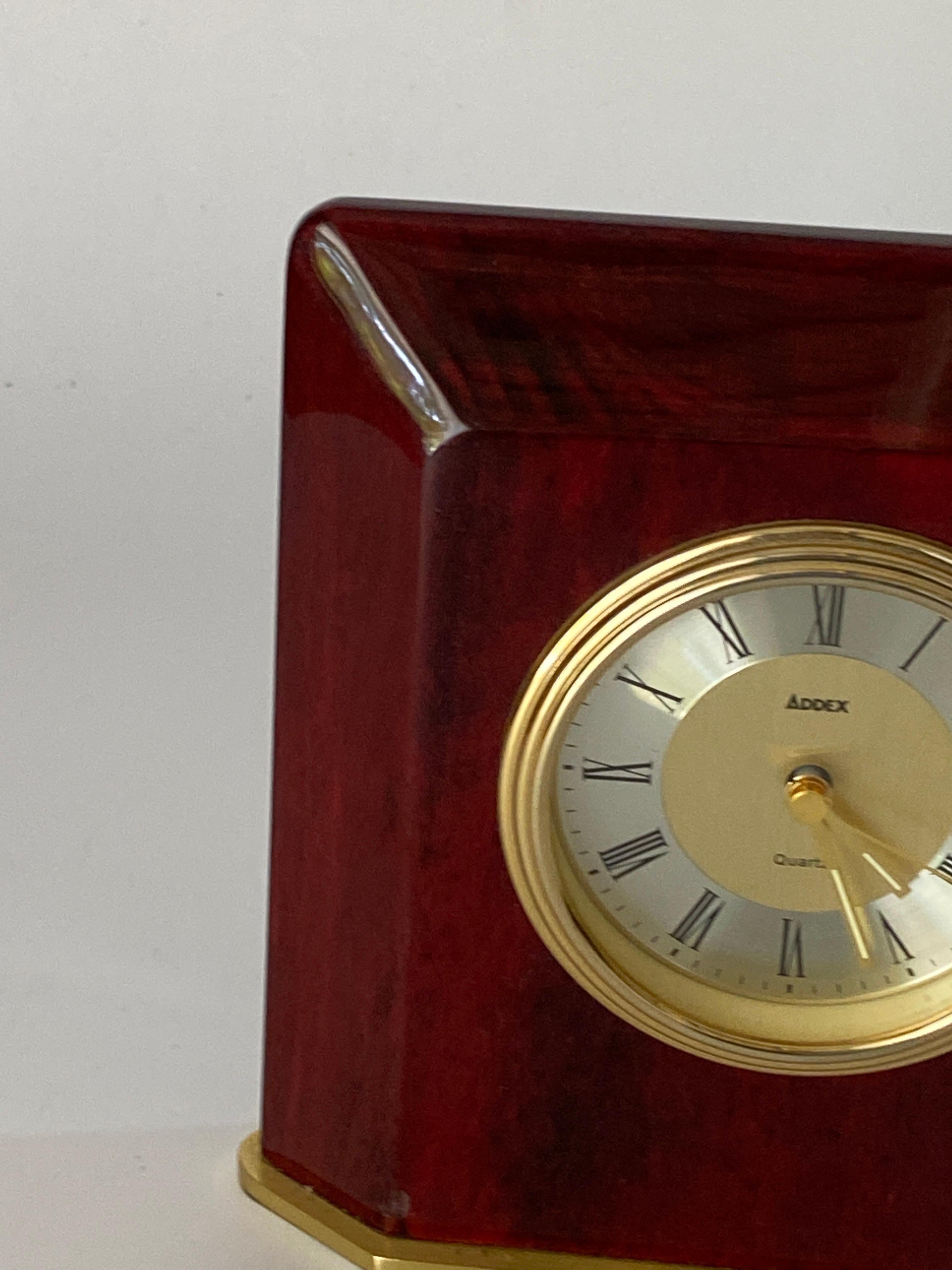 French Table Clock, Modern Shape, Burgundy Color, Hard Plastic and Brass, France 1970 For Sale