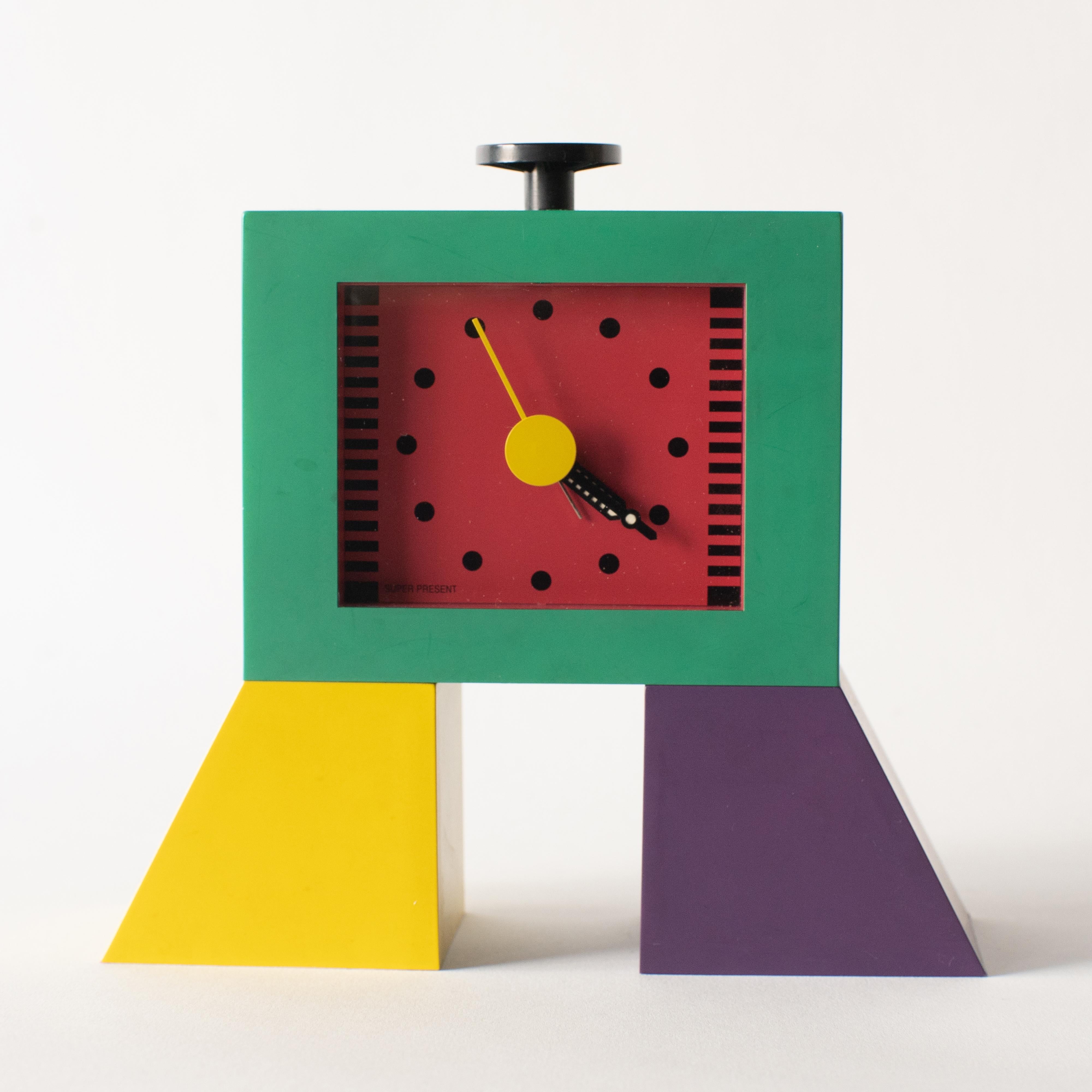 Table clock by Wakita hi-tecs, Japan. Wakita hi-tecs produced a lot of small pieces in the 1980s-1990s under the name of superpresent. 
Especially Shohei Mihara's clock series are famous. This clock is representative work from the series.
    