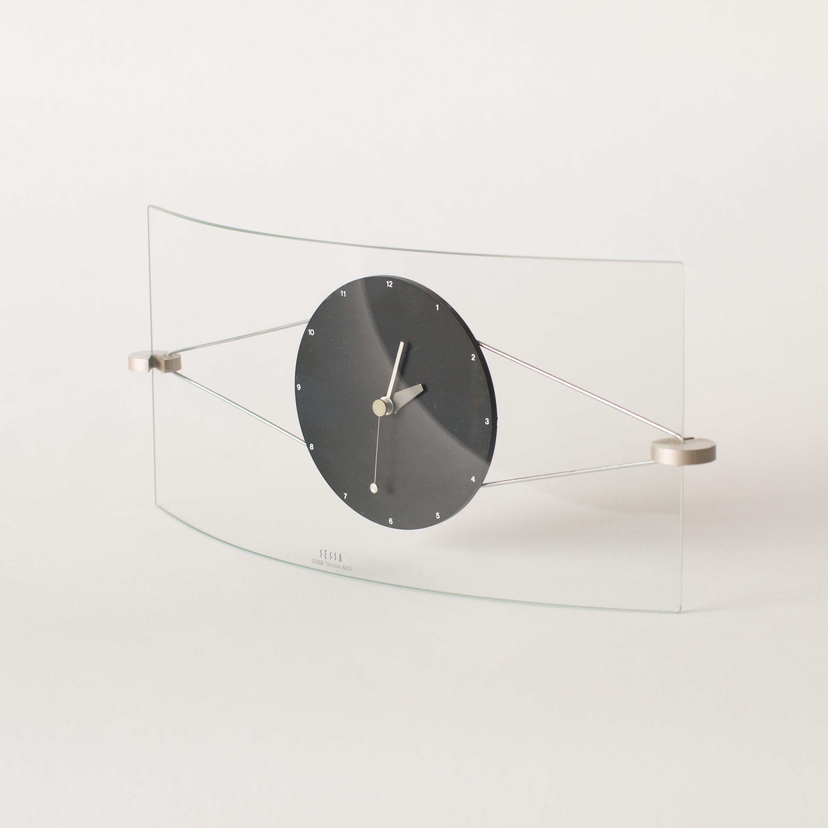 Wall clock by Sessa. Takashi Kato designed a lot of clocks in the 1980s-1990s. Some of clock collections were released from Neos Lorenz in European Market. which sold together with Natherie du Pastier and George Sowden works.
