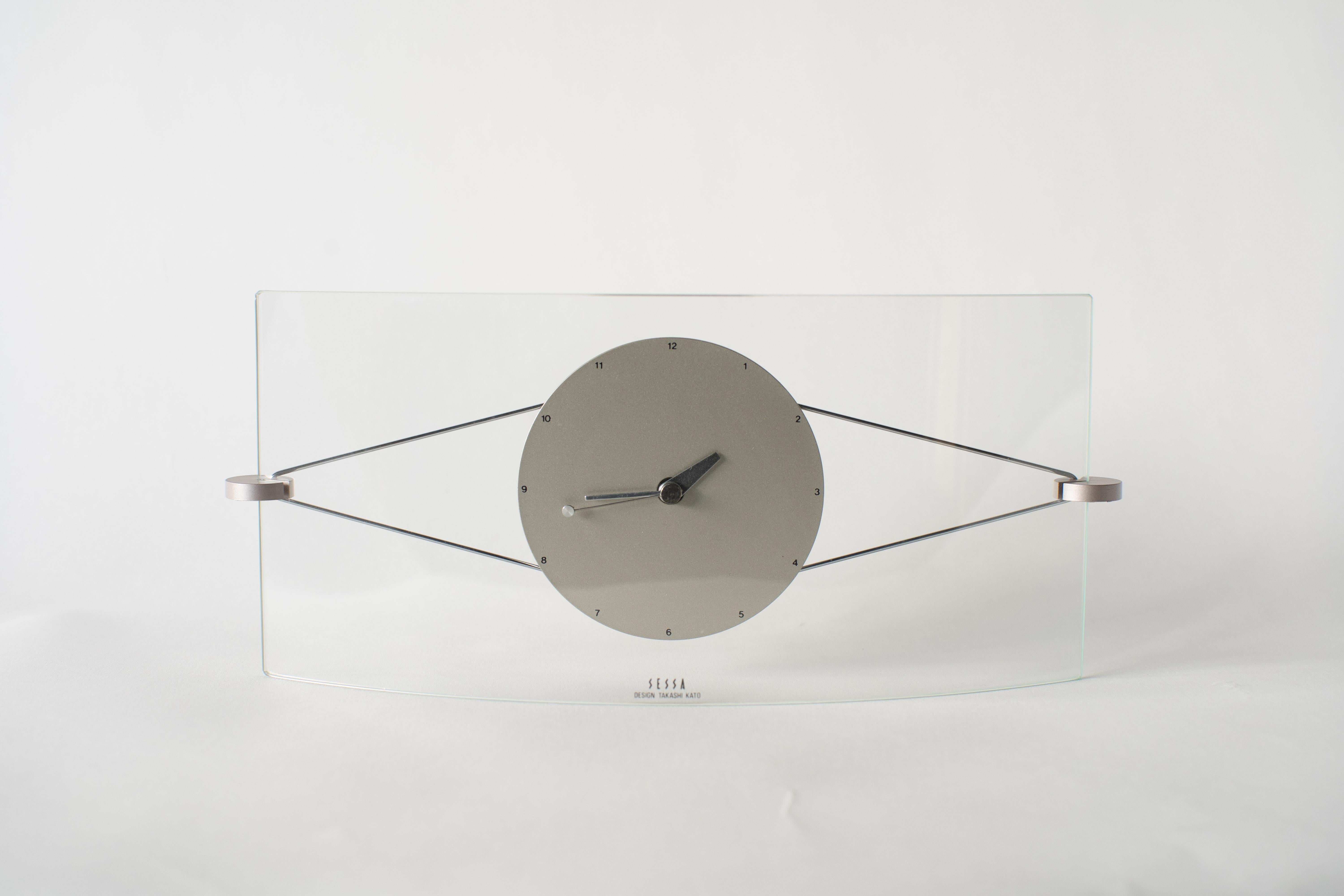 Wall clock by Sessa. Takashi Kato designed a lot of clocks in the 1980s-1990s. Some of clock collections were released from Neos Lorenz in European Market. Which sold together with Natherie du Pastier and George Sowden works.