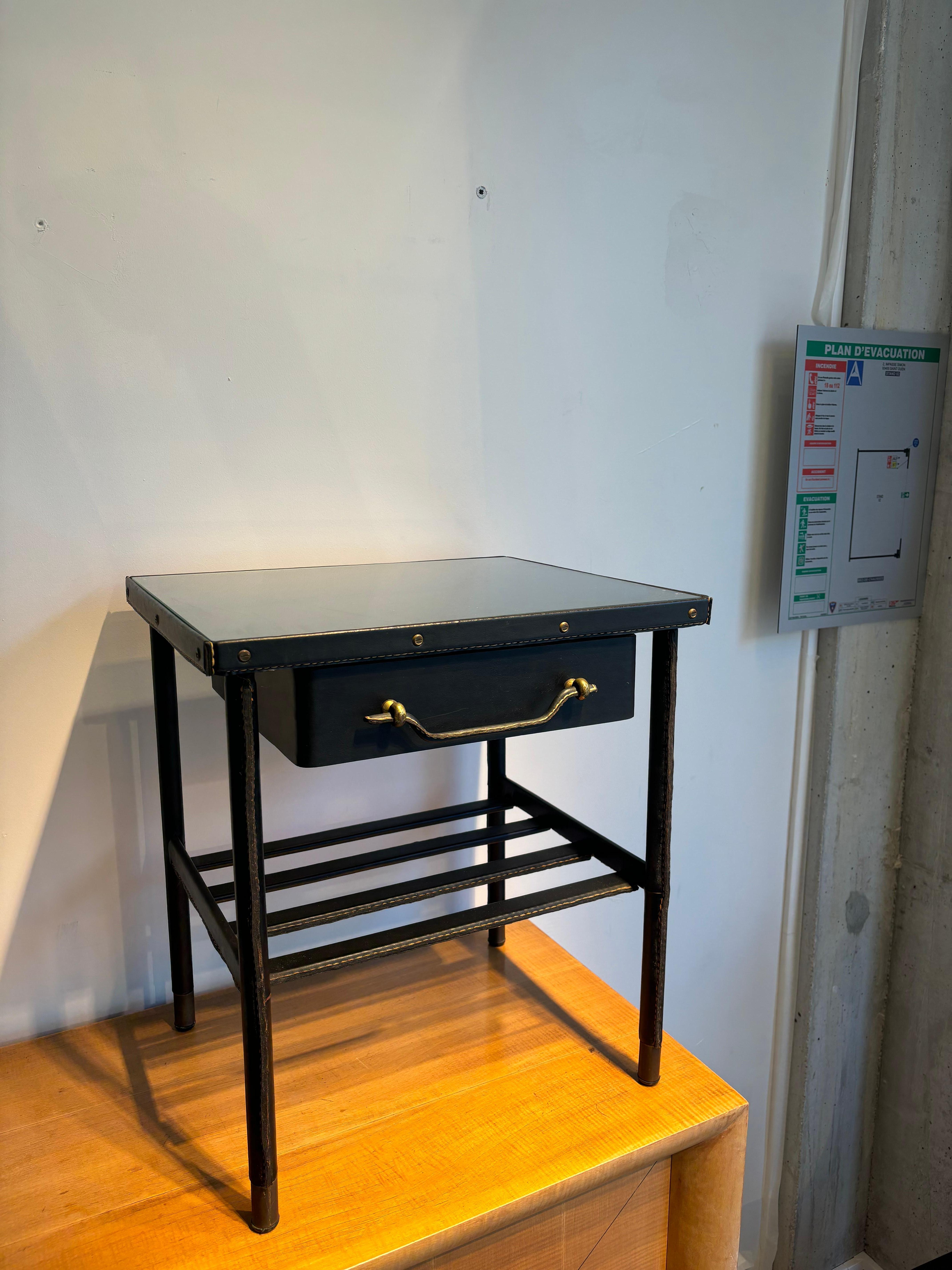 Rare and cute side table by Jacques Adnet in perfect condition 