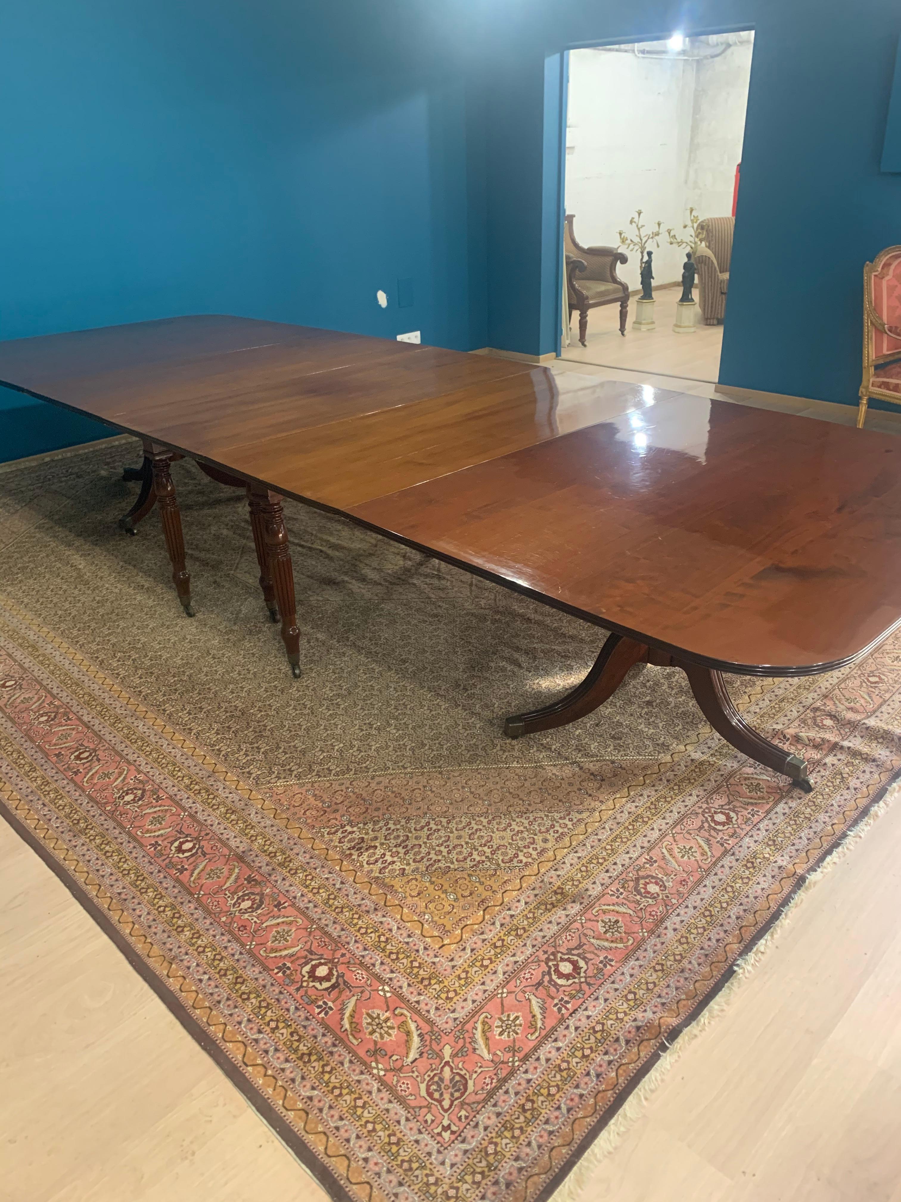 Regency  Dining table combined with another table on legs in extension.