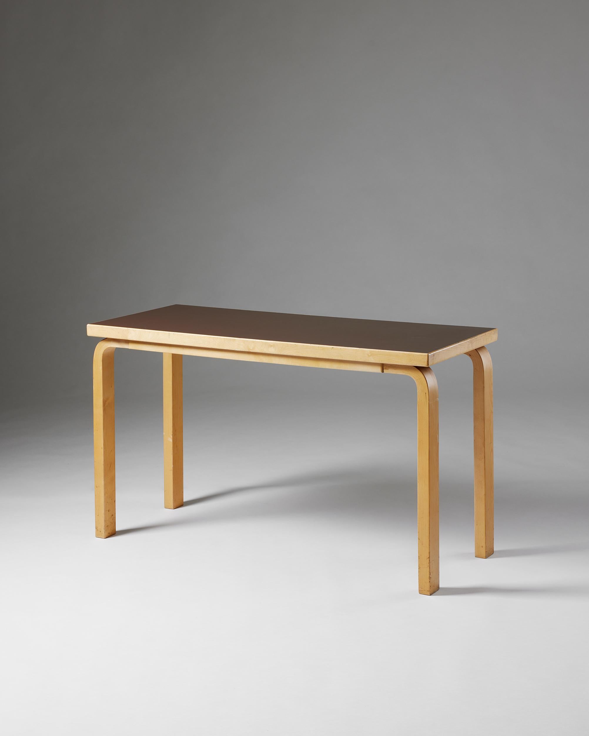 Table designed by Alvar Aalto for Artek,
Finland, 1970s.

Lacquered birch and laminate.

Alvar Aalto was a Finnish architect and designer. His work includes architecture, furniture, lighting, and glassware, as well as sculptures and paintings. He