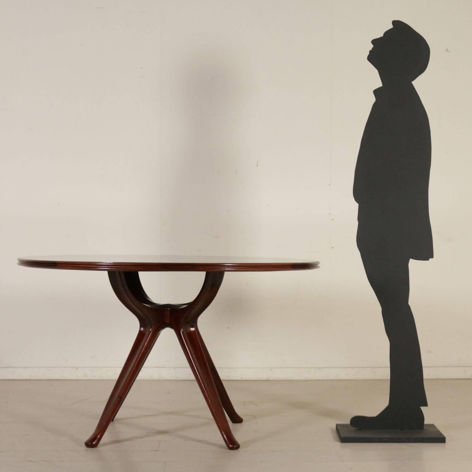A table designed by Osvaldo Borsani (1911-1985), mahogany, retro treated glass. Manufactured in Italy, 1950s.