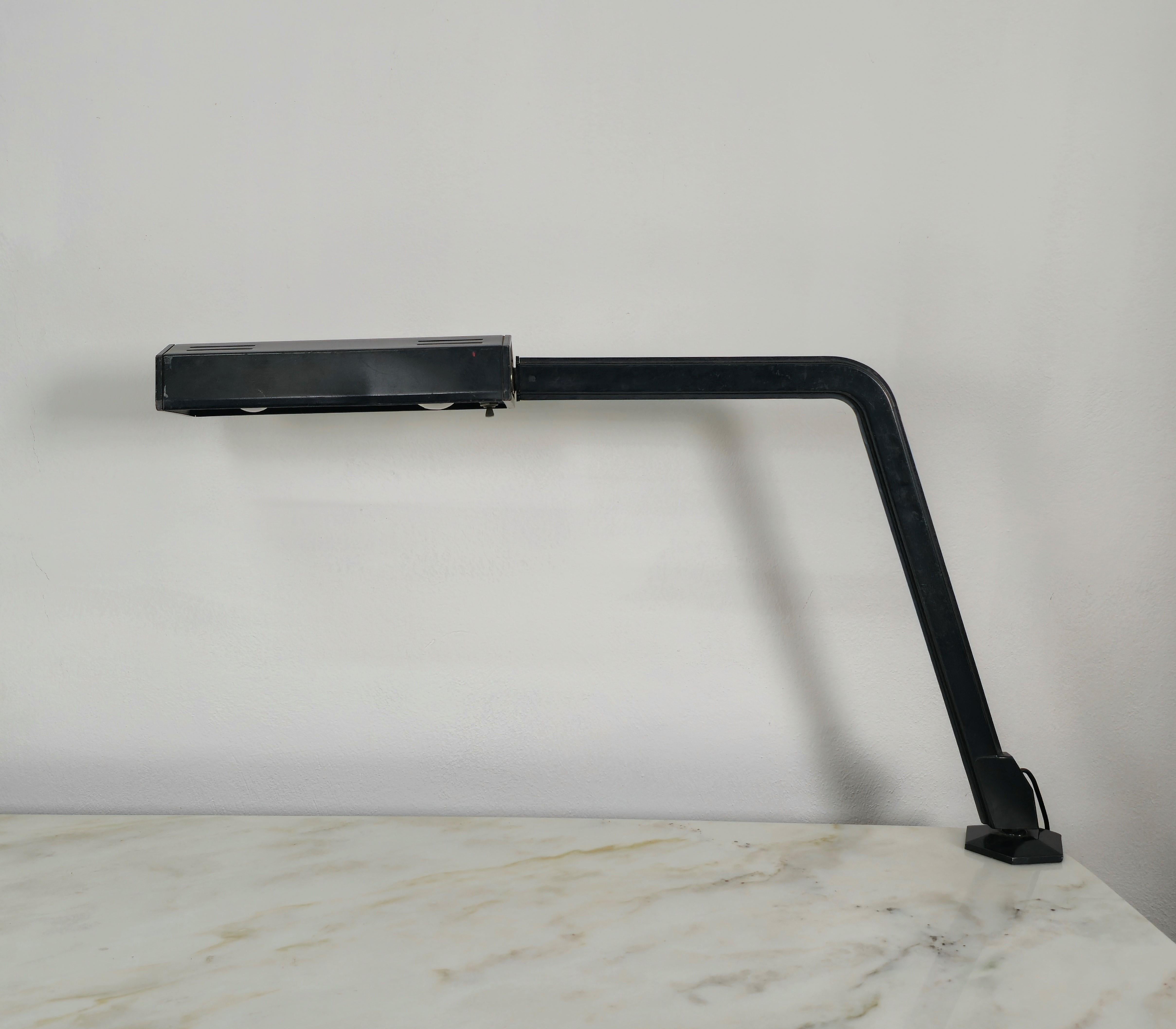 Rare table or desk lamp designed by the BBPR architects' studio and produced in the 1960s by Olivetti.
The lamp was made of black lacquered metal with the adjustable diffuser and extendable mechanism in chromed metal.


Note: We try to offer our