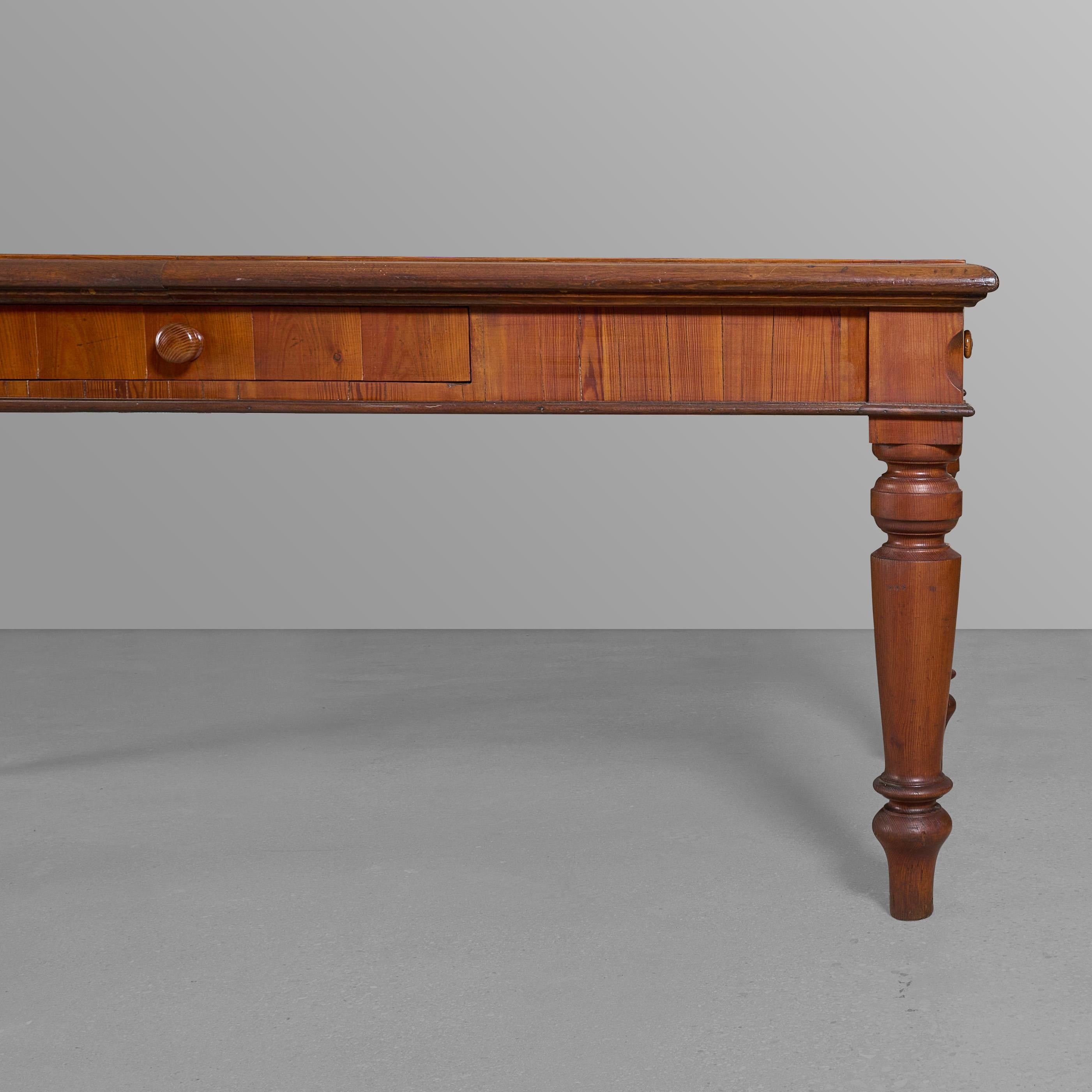 Table/desk with an inlaid wood herringbone design.

 