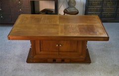 Table en chêne massif piètement central avec rangement Charles Dudouyt 1950's
