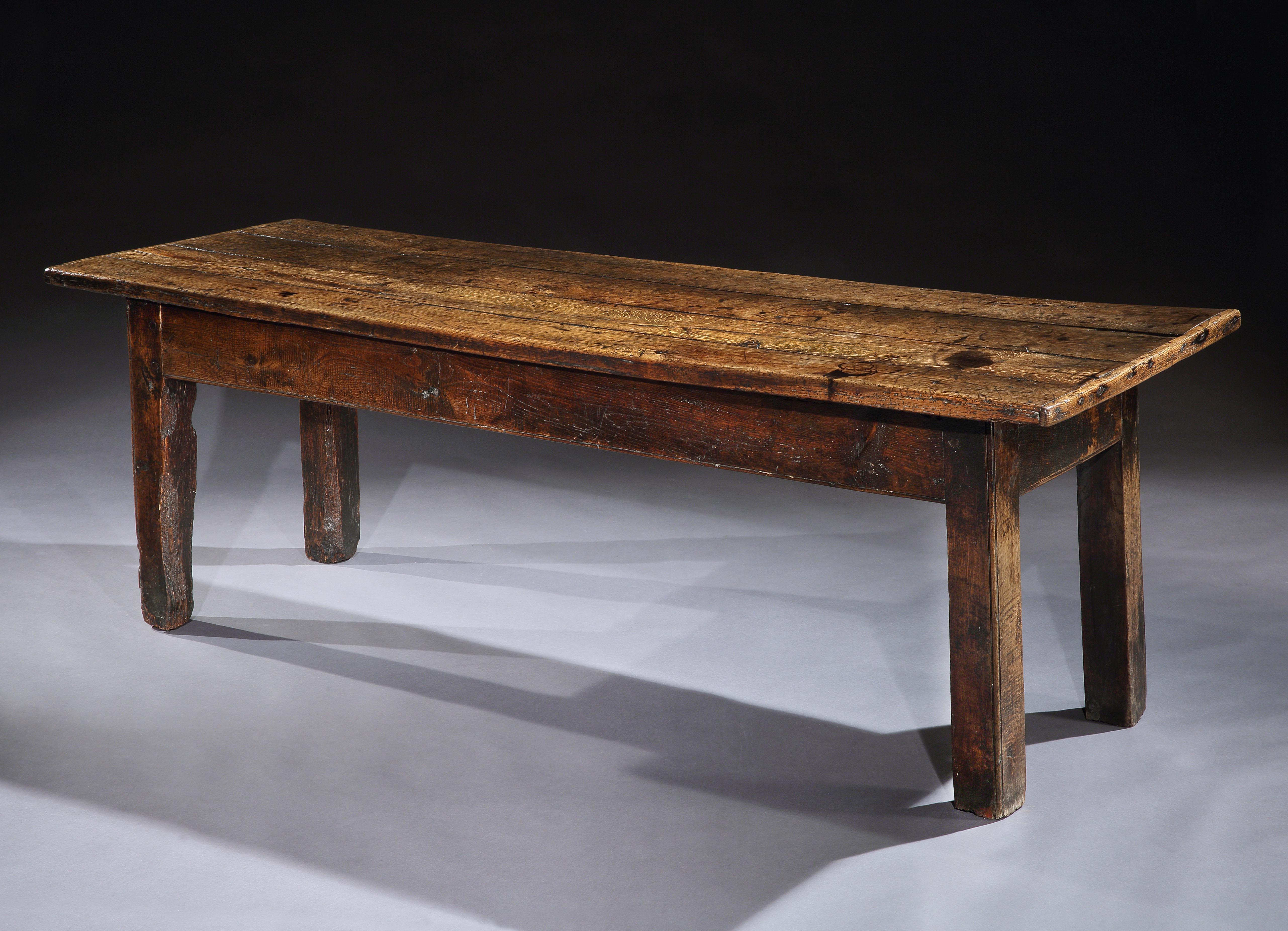 This farmhouse table exudes character which is an essential feature of vernacular furniture and is the best example of its type that I have seen. The thick, oak top is tactile and sculptural with beautiful figuring and an exceptional, lustrous