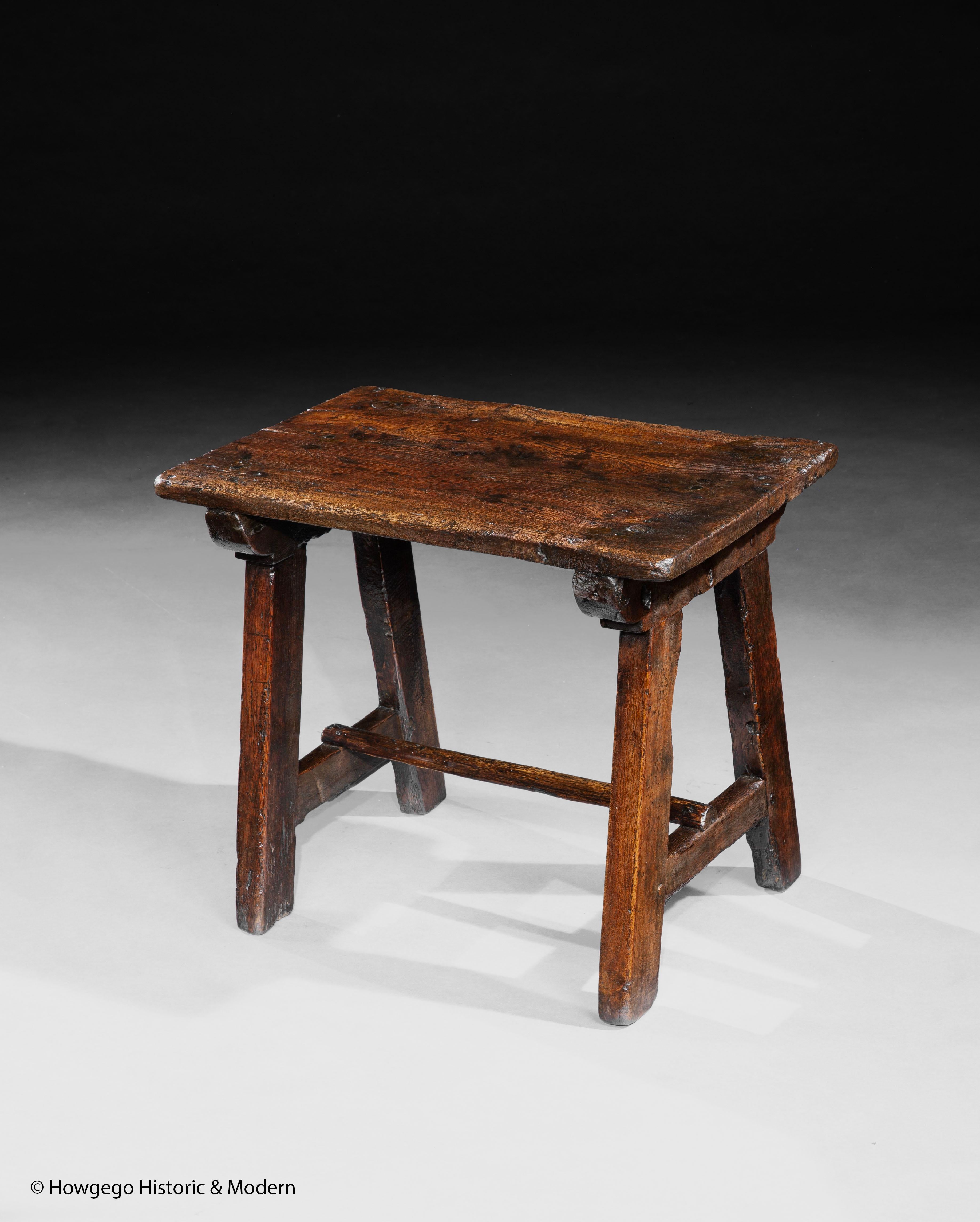 - Rare small size, perfect height for sofa's and modern armchairs
- The single plank elm top with beautiful figuring and stick legs are characteristic of folk and vernacular furniture
- This table exudes vernacular/folk charm 

Single plank top on