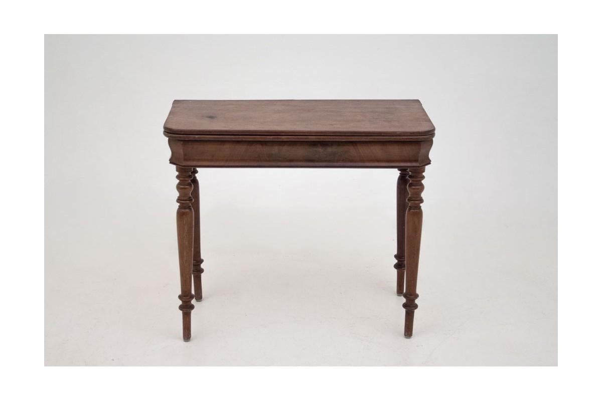 An antique gaming table karciak from the late nineteenth century.

Dimensions: height 76 cm / width 88 cm / depth 44/88 cm

A stylish table called karciak was made at the end of the 19th century. A rectangular top with rounded corners, when
