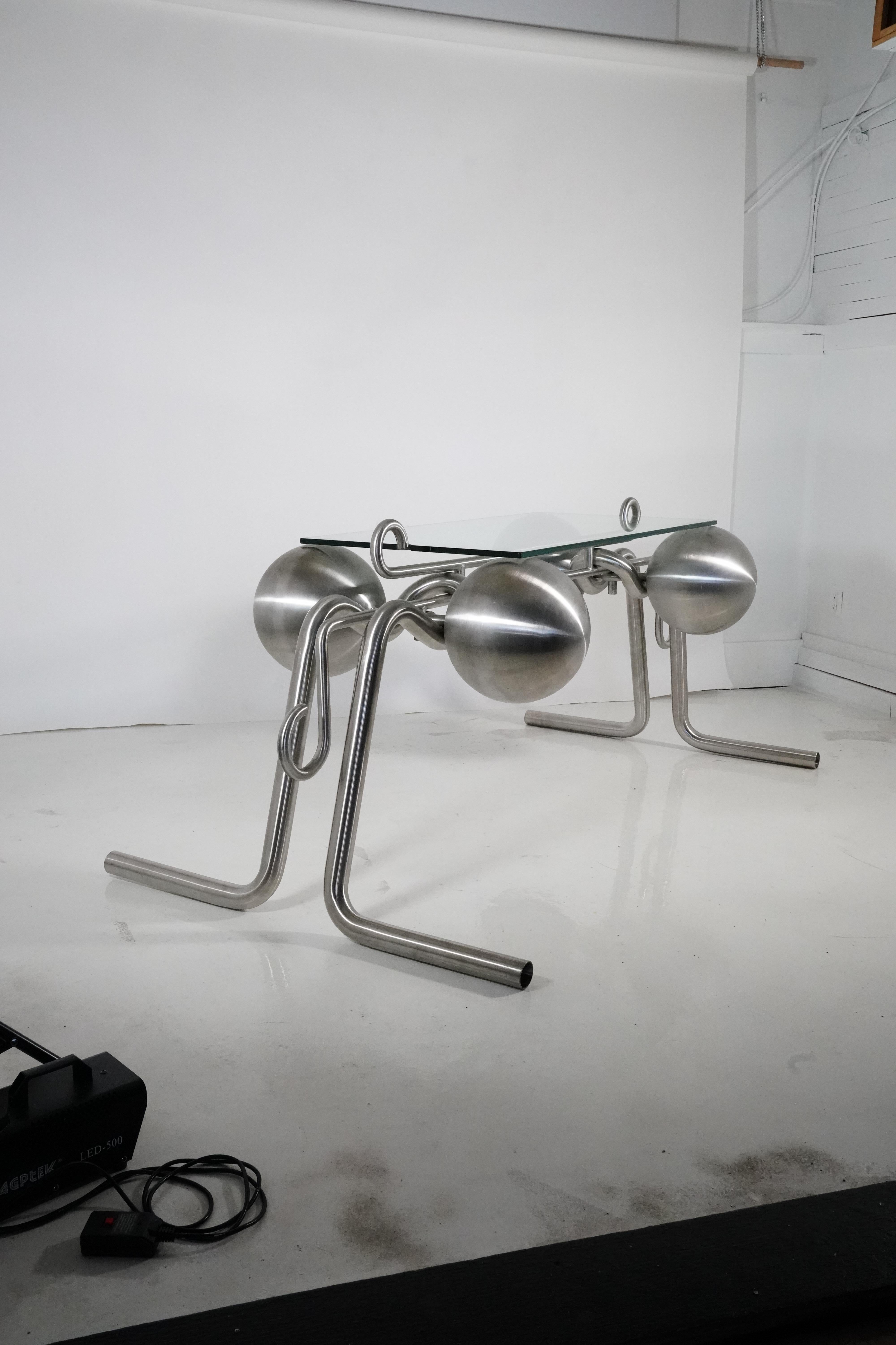 Table For the Artless Administrator by Kevin Li
Dimensions: W 203.2 x D 101.6 x H 76.2 cm
Materials: Stainless steel, Tempered glass
Material options: weather-resistant/non-rusting, non-magnetic, highly - temperature resistant. Alternative steel