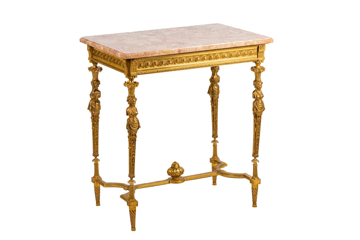 Adam Weisweiler, in the style of. 

Table in chiseled and gilt bronze.Tray in rose marble. Legs adorned with caryatids topped by a vase of flowers, below them fall garlands of flowers, all united by a spacer adorned by a chambord vase in its